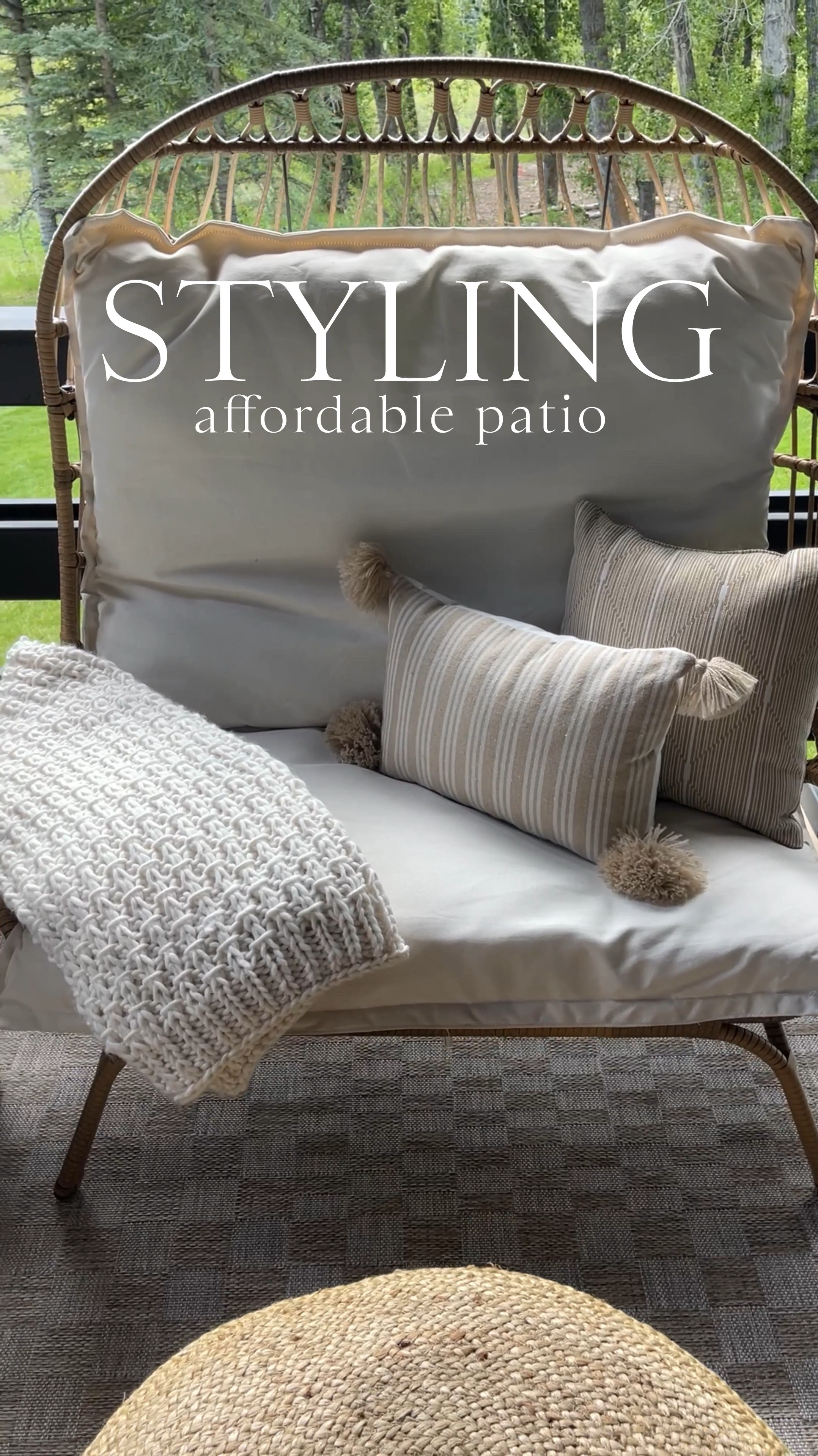 HOME \ affordable outdoor patio styling💁🏻‍♀️ SO many great furniture and decor finds from Amazon, Walmart and Target!! Here’s what I’m using in this space👇🏻
+ checkered jute rug 5’x7’ $89
+ oversized chairs $298
+ decorative pillows $17
+ concrete side table $86
+ basket & flowers 
+ black side table $95
+ wicker lantern $40
+ large jute pouf
+ knit blanket $49

#LTKSeasonal #LTKVideo #LTKHome