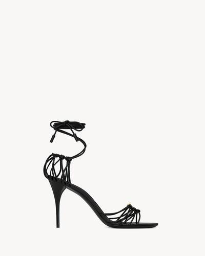 laced stiletto sandals decorated with the CASSANDRE, featuring an almond toe and lace-up ankle st... | Saint Laurent Inc. (Global)