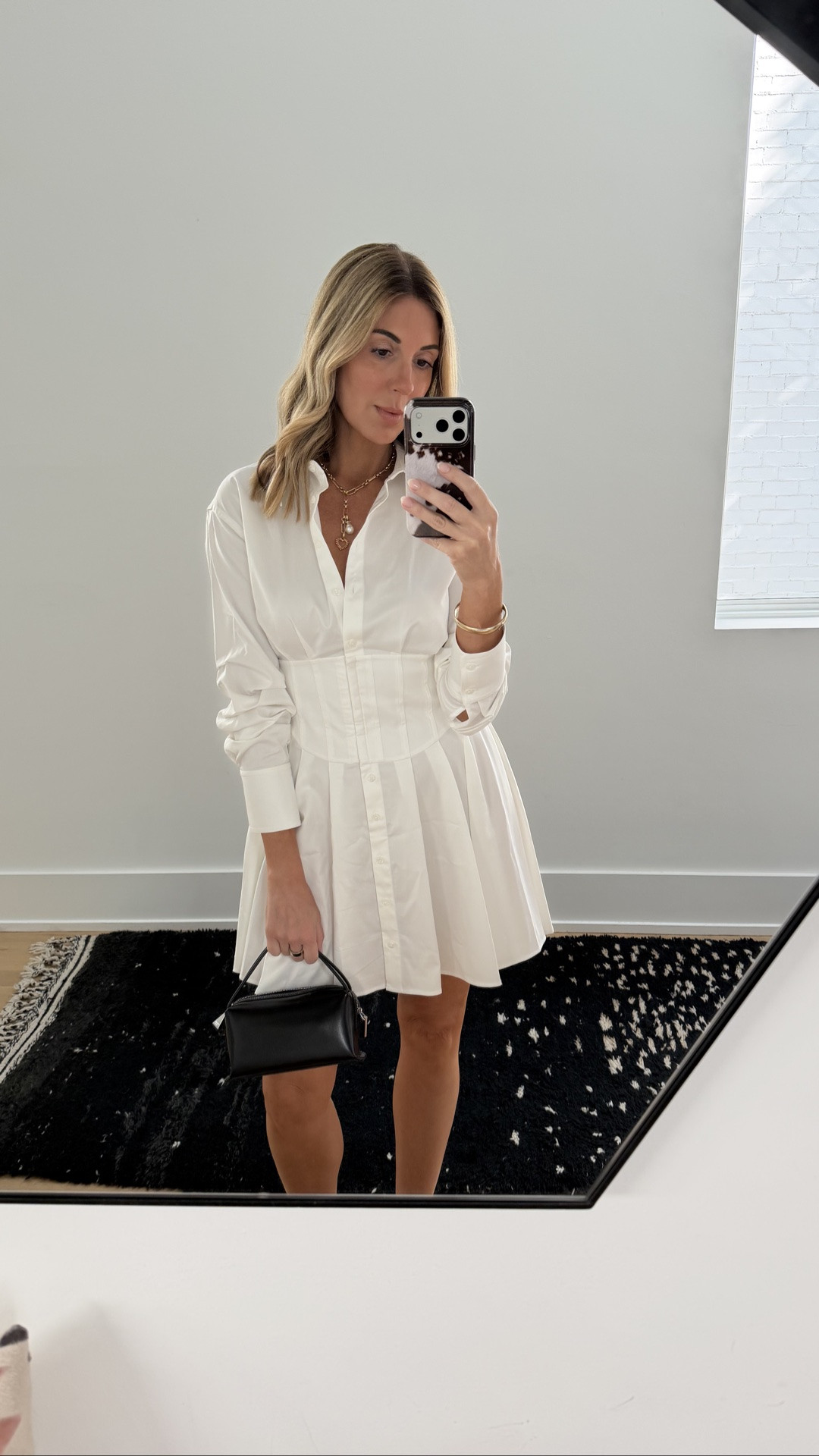 The perfect white shirt dress. This @Alice + Olivia  button-down mini has the prettiest corset-style fitted waist and pleated skirt — such an elevated take on a classic white button-down. Easy to dress up with heels or wear with flats or boots for fall. Wearing it with simple black accessories + gold jewelry.

Alice + Olivia white shirt dress | white button-down dress | corset waist dress | white mini dress | fall transition outfit | work to dinner outfit | classic white dress

#LTKdayinmylife #LTKootd #LTKWorkwear