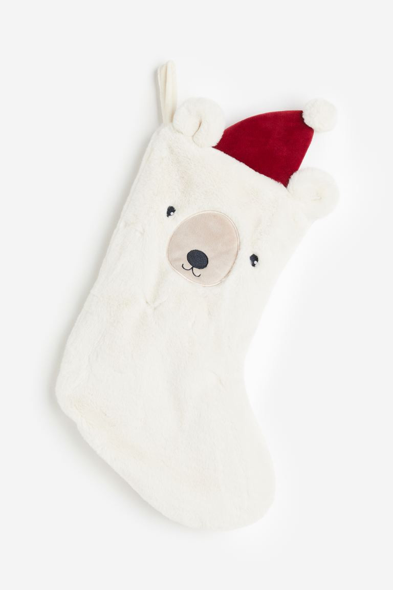 Calcetín navideño en peluche | H&M (FR, IT, ES, PT, BE)