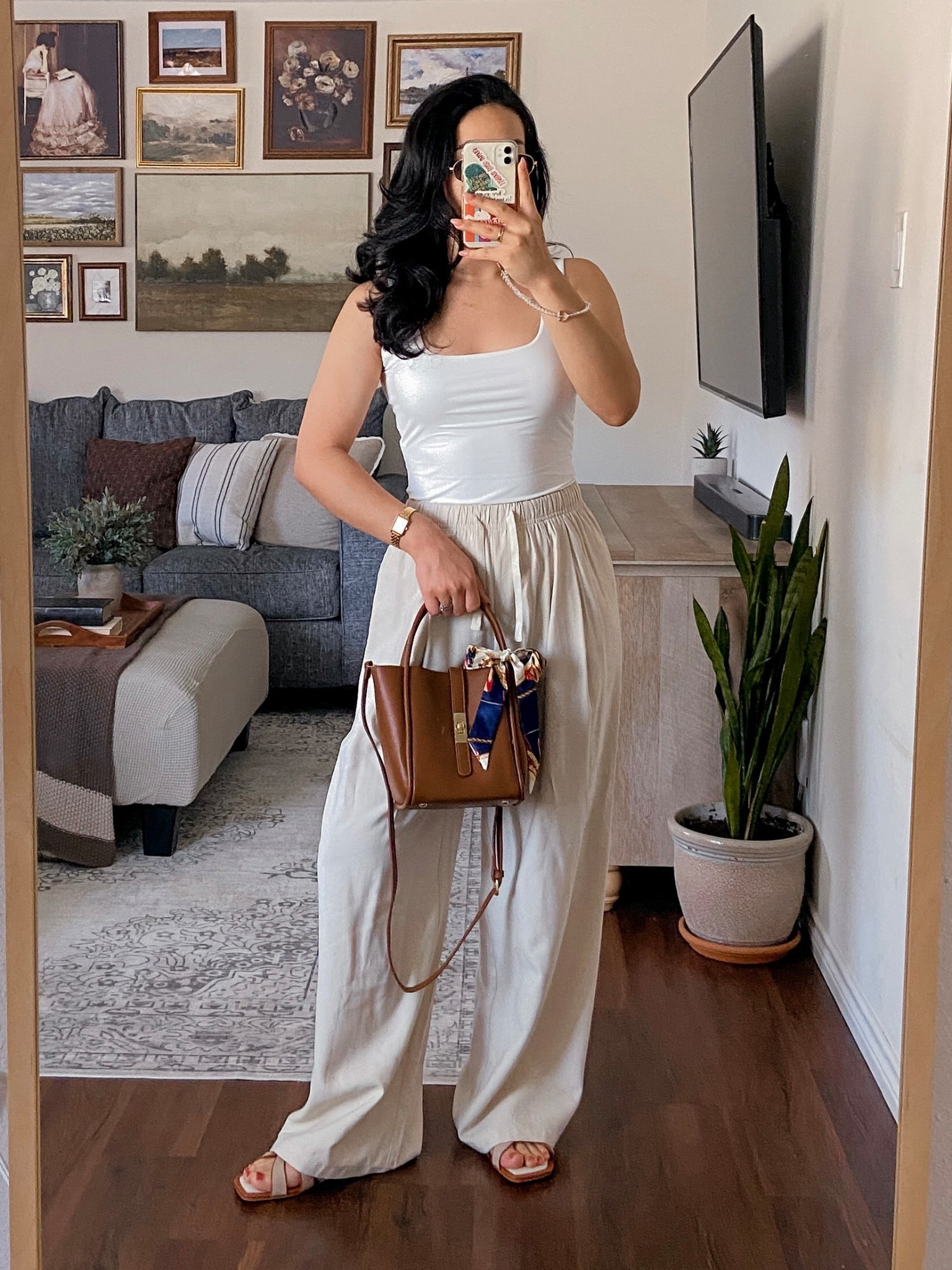 outfit of the day 👜🌤️🤎 wearing this double-lined tank top from amazon in a size medium and it fits true to size, wearing these summer pants from dazy in a size large and they fit like a medium, and accessorized the fit with a brown bag and sandals for a neutral & chic summer look. 

🏷️: summer outfit, summer style, summer ootd, outfit of the day, neutral summer outfit, minimalistic outfit, chic summer outfit, amazon fashion finds, amazon style, amazon fashion, 

#LTKSaleAlert #LTKSeasonal #LTKStyleTip