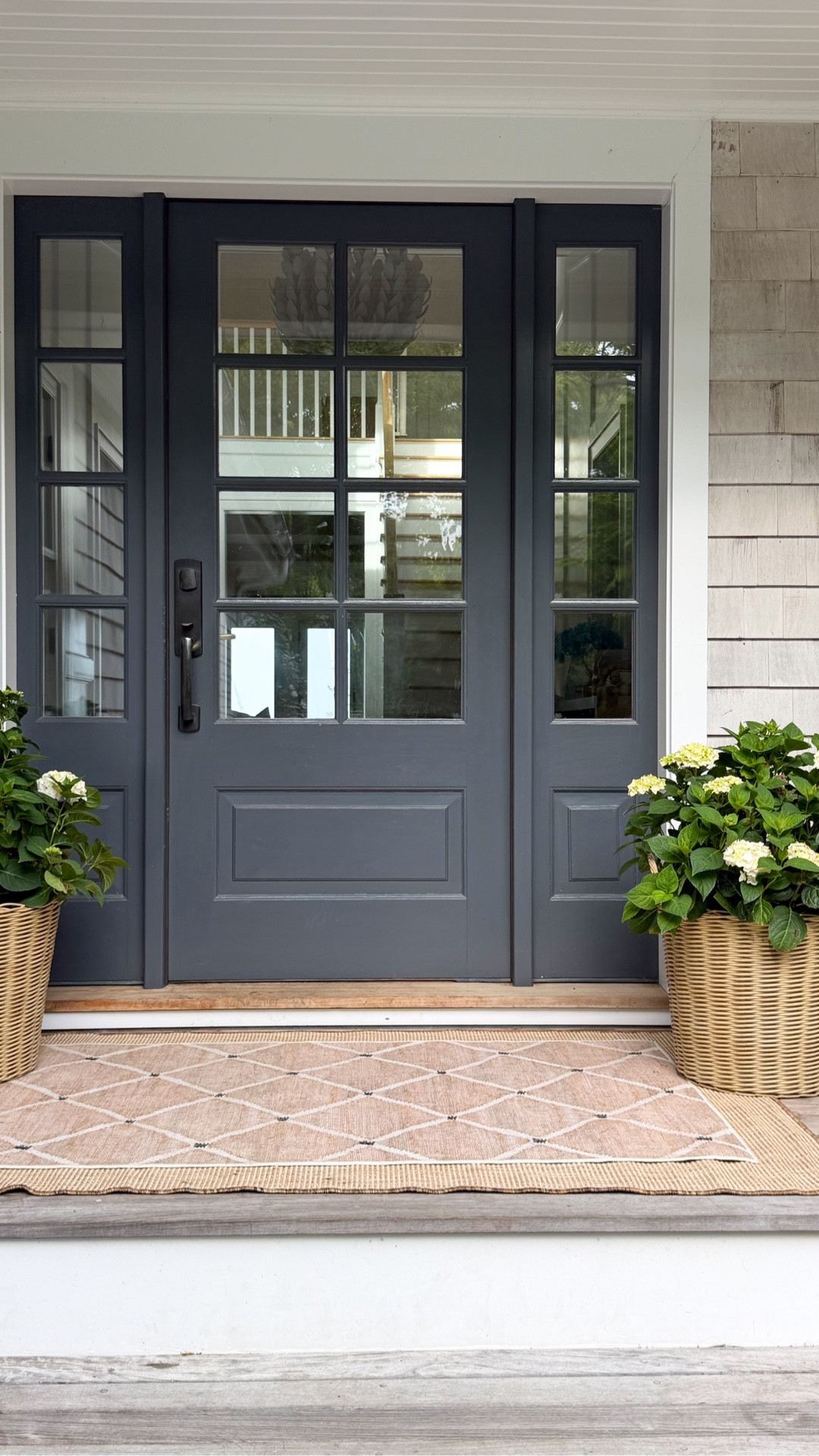Getting the front porch ready for those summer nights. Large layered rugs, a sweet bench and some simple hydrangeas will always do the trick.

#LTKHome