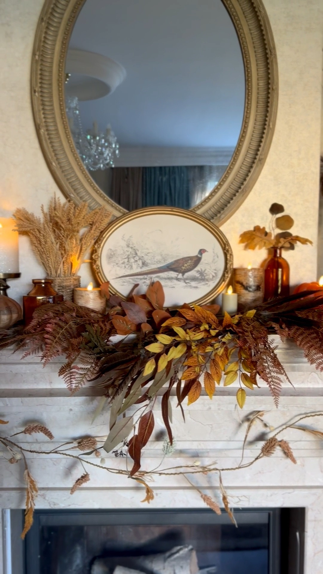Fall living room mantel decor with @Michaels leaf stems, pheasant wall art, pumpkin candle, neutral colors

#LTKHome #LTKSaleAlert #LTKSeasonal