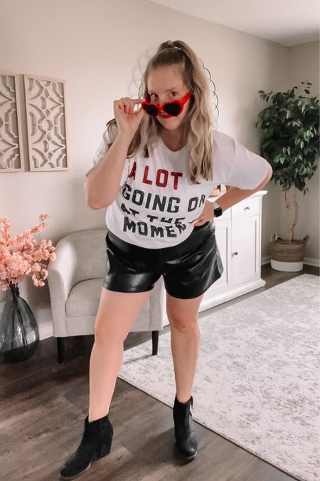 Taylor Swift Concert Red Era Outfit Inspo ✨ Eras Tour Outfit Idea with red heart sunglasses, faux leather shorts, short black booties and the A Lot Going on at The Moment shirt. Perfect comfortable country concert attire! 

#LTKunder50 #LTKFind #LTKcurves