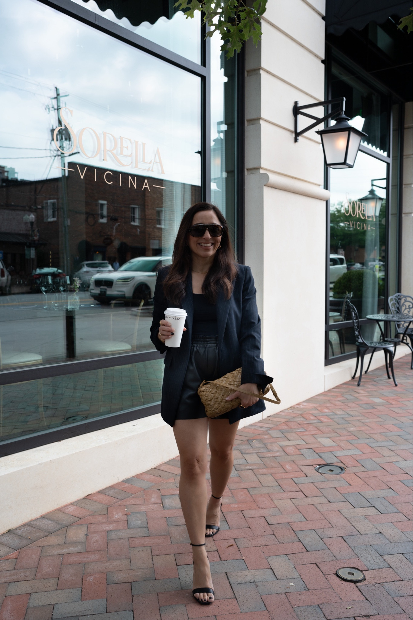 Stopping for coffee in between appointments… I’m obsessed with the navy pinstripe blazer trend! I’m wearing mine with a lightweight cami, leather shorts, and a heel. I love how the caramel bag replicates the color of my skin, keeping the look simple yet comfy & decadent! 

#LTKover40 #LTKitbag #LTKstyletip