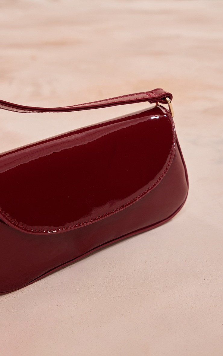 Burgundy Patent Slim Curved Shoulder Bag | PrettyLittleThing US