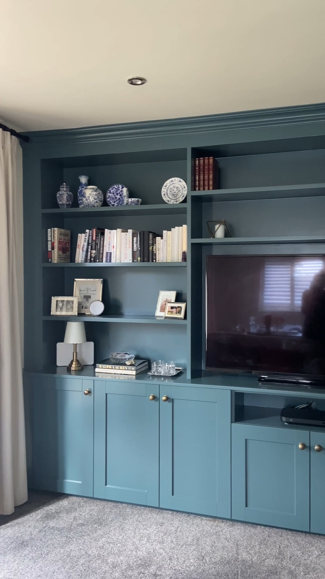 Ralph Lauren inspired shelf styling 📗🌳🐎 Classic, layered, and a little luxe. Use silver frames, coffee table books, blue and white china, and leather-bound details.

Linked everything you need to get the look on my LTK timeless style made simple. 

#LTKStyleTip #LTKHome