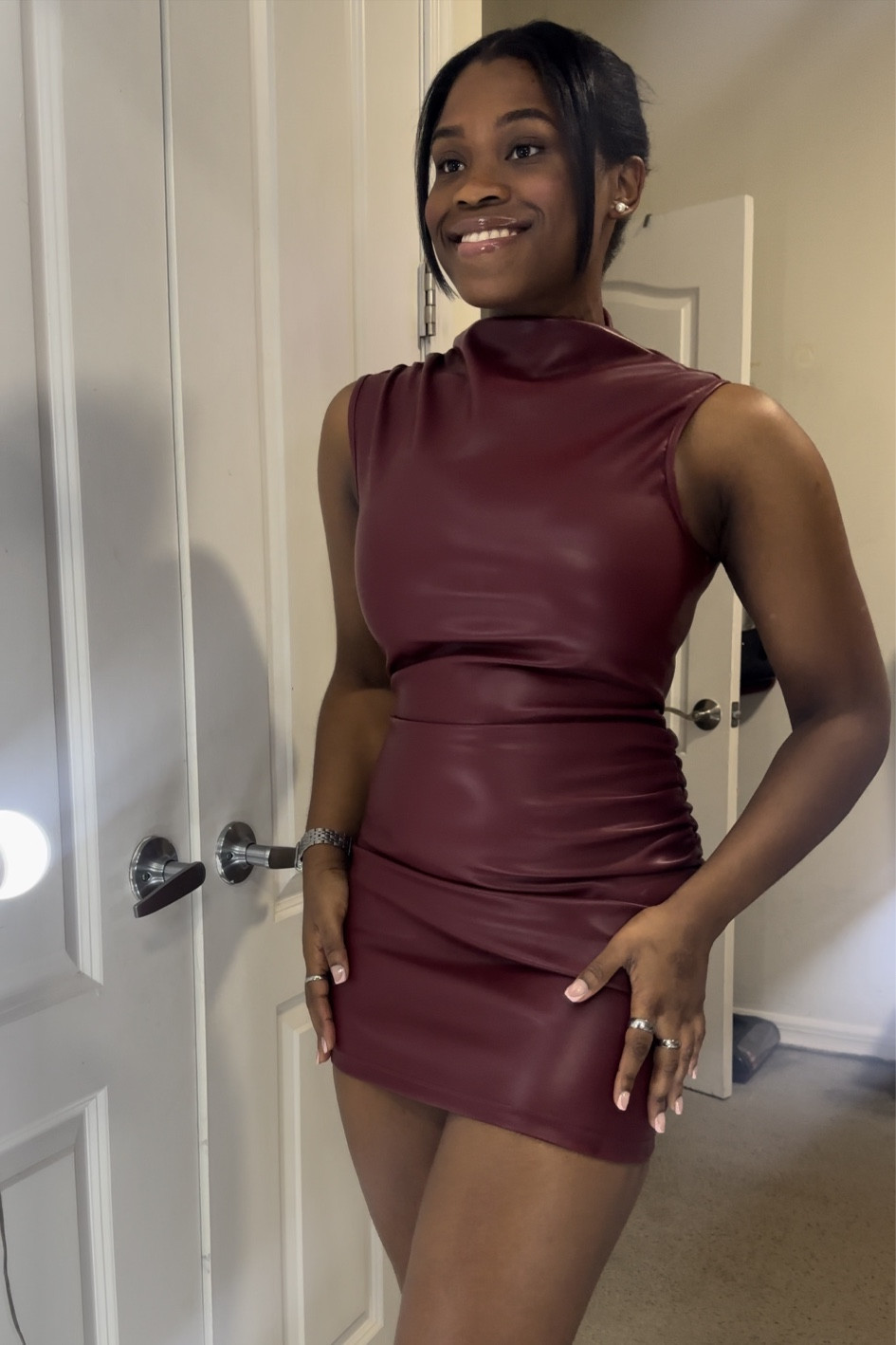 The perfect leather dress and color for the holiday season! Wearing a small. 