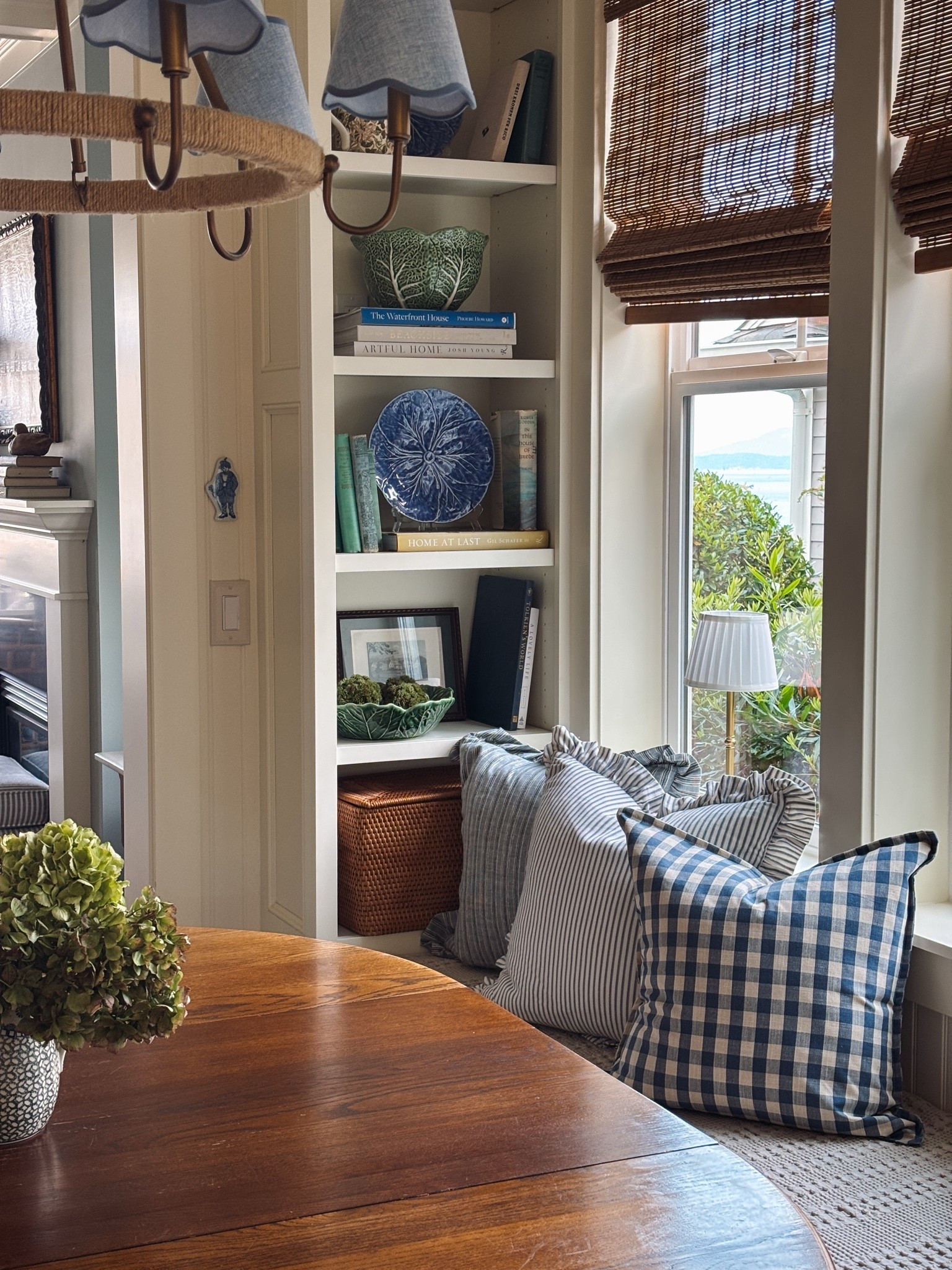 Patterned pillows (gingham, striped, ruffled), blue scalloped chandelier shades, bamboo shades

#LTKSaleAlert #LTKHome #LTKSeasonal