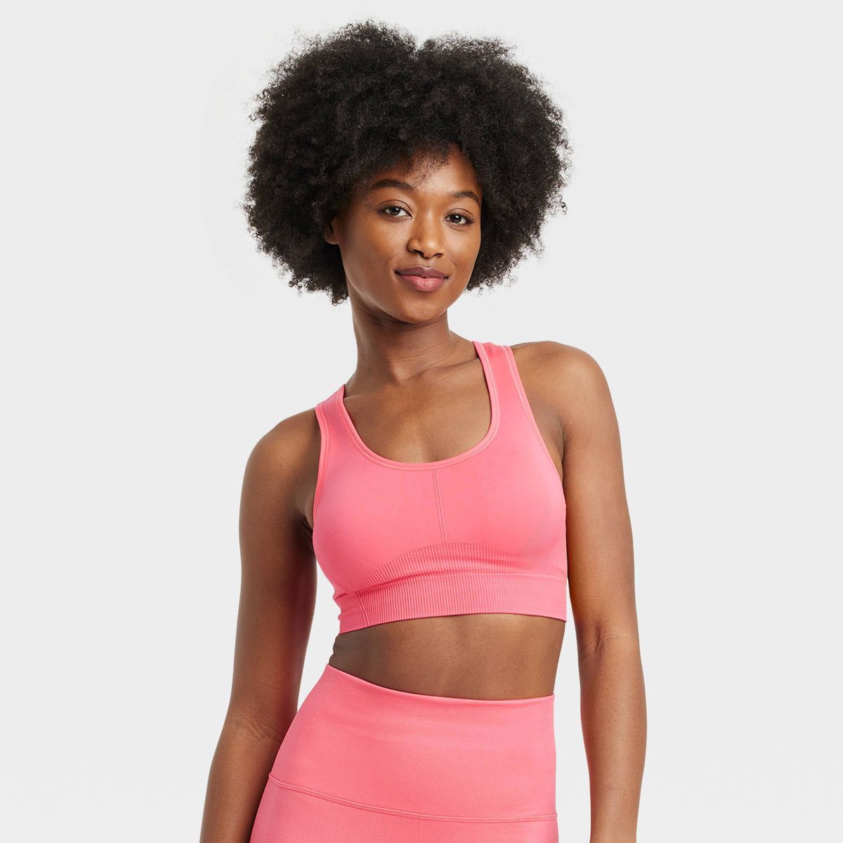 Women's Seamless Medium Support Racerback Sports Bra - All In Motion™ Coral Pink M | Target