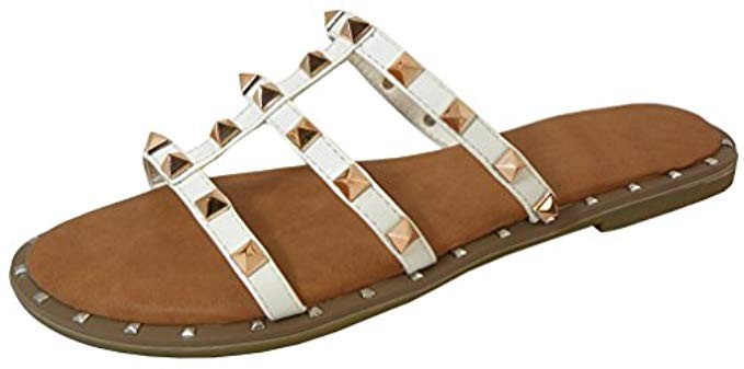 Cambridge Select Women's Strappy Open Toe Caged Cutout Pyramid Studded Slip-On Flat Slide Sandal | Amazon (US)