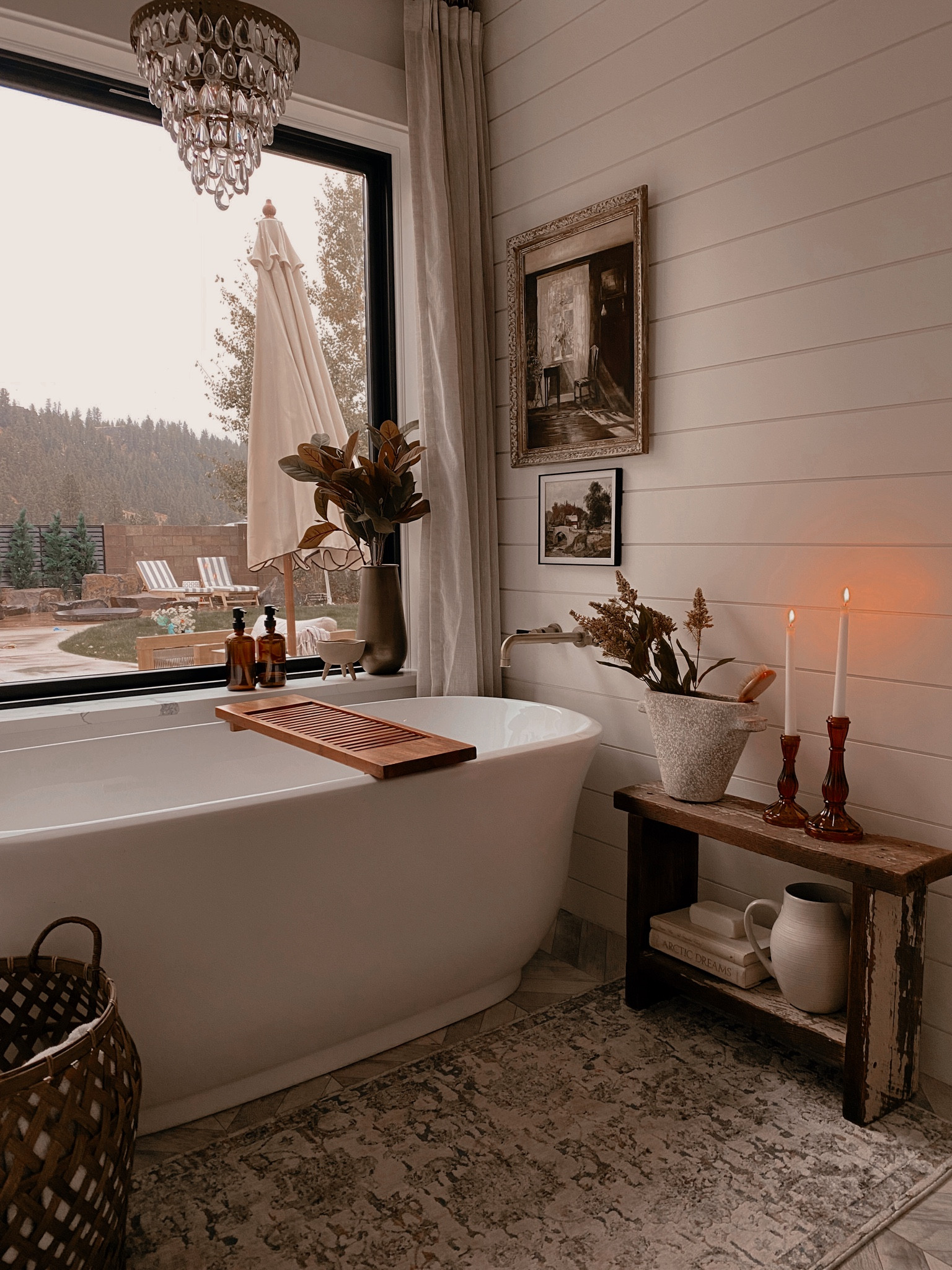 Rainy Day Bathroom View | brass tub filler, framed art, tub tray, rug, candles, basket, fall florals, pitcher, tub

#LTKHoliday #LTKhome #LTKSeasonal
