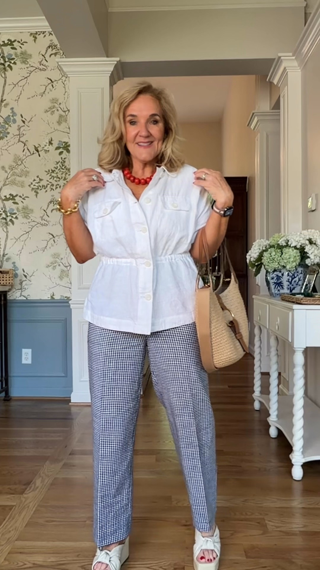 This outfit is full of timeless pieces with a fun pop of color! ❤️ A crisp white jacket paired with gingham wide-leg pants creates an easy, polished look, and the bold red necklace adds the perfect finishing touch. Add a woven tote and platform sandals, and you’re ready for lunch, shopping, or a summer getaway.

Comfortable, classic, and effortlessly chic!

💡 LTK MADE EASY
❤️ Heart = Support my posts!
🔖 Save = Get sale & restock alerts
📋 Lists = Keep favorites organized
📲 Share = Send lists and products to a friend. Hello, Christmas List!
💬 Comment = Ask me anything about what I’m wearing. :-)

#LTKootd #LTKSeasonal #LTKOver40