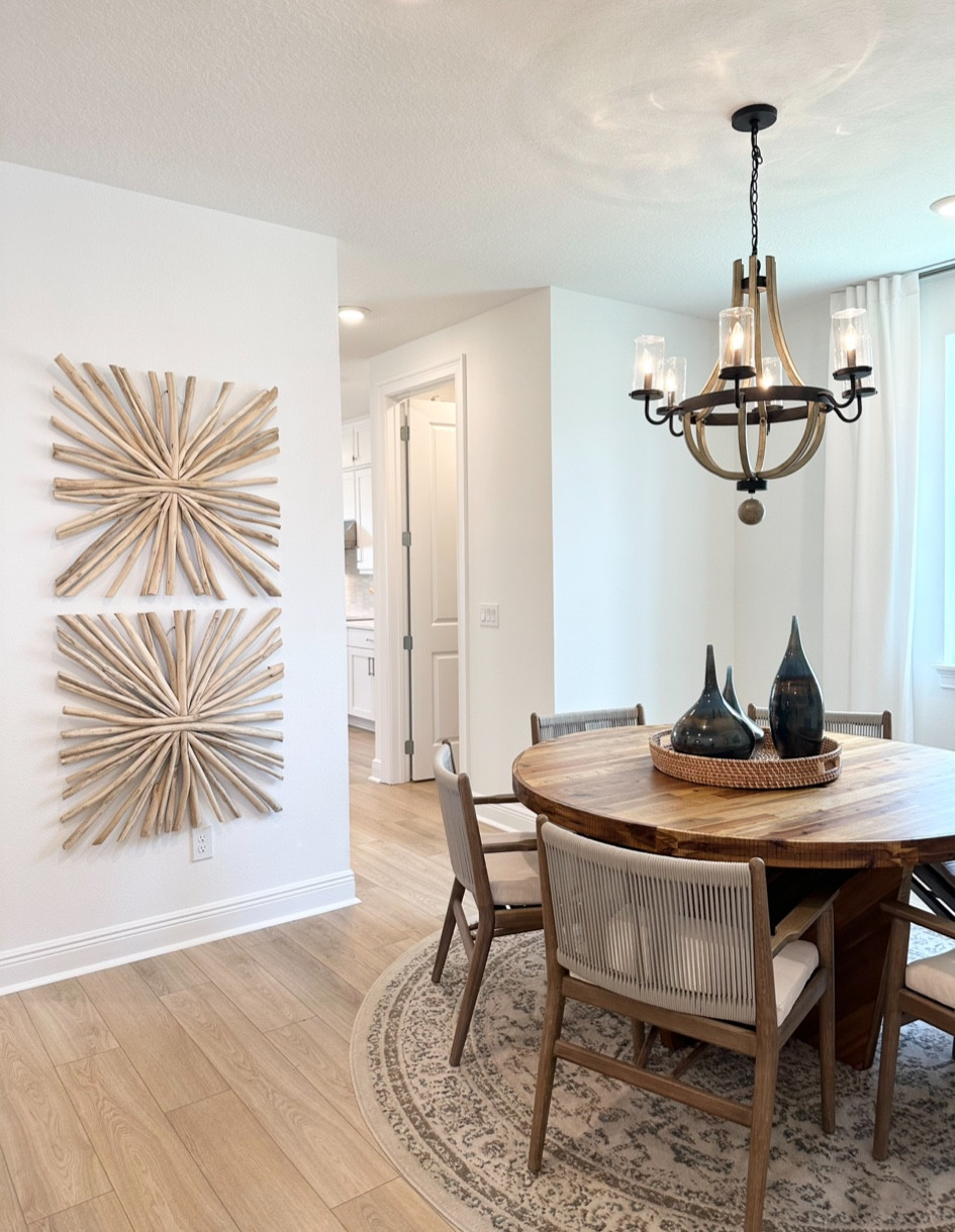Dining Room with round table that seats 6 with chandelier.

#LTKhome