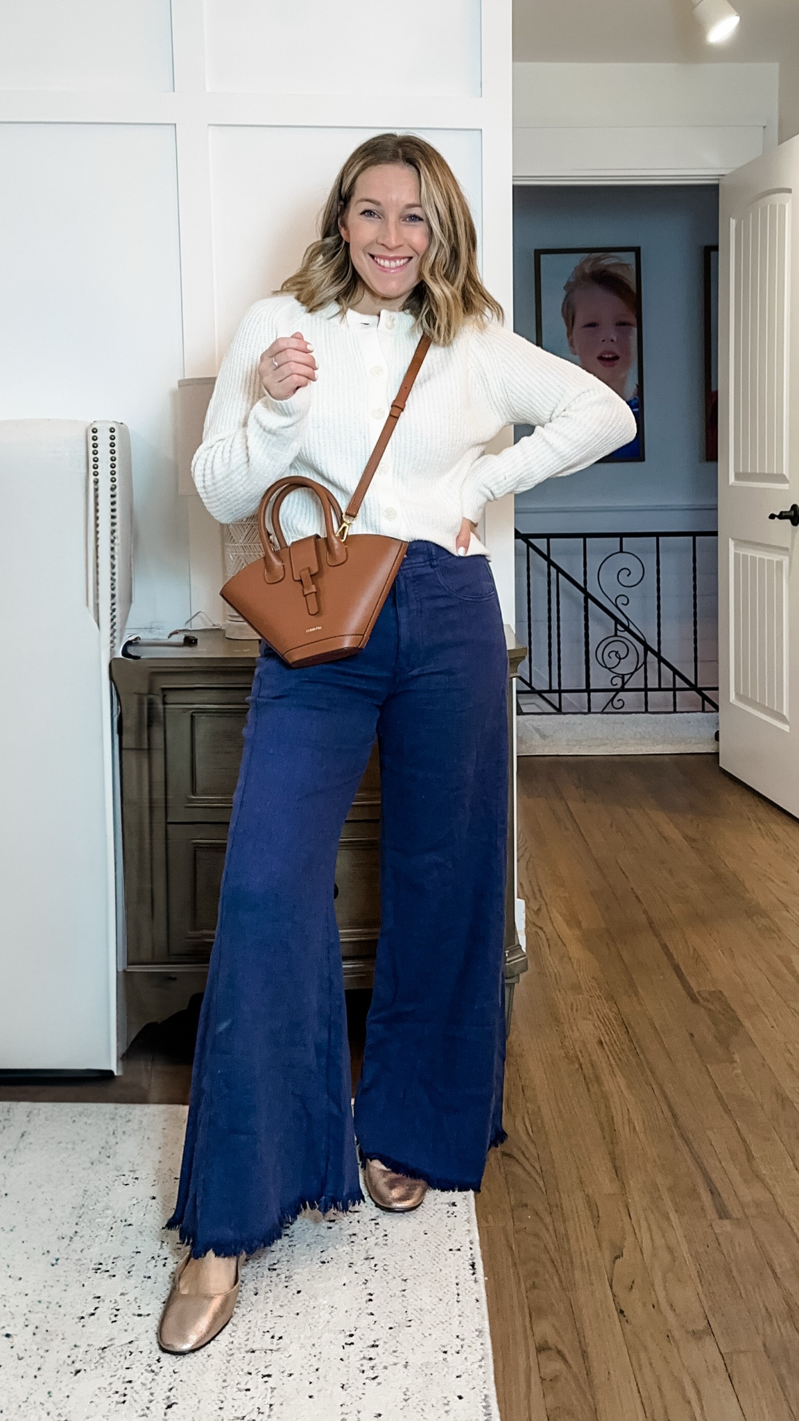 Loving this winter vibe with the dark navy pants (that are SO soft) and rose gold shoes with the ivory! This little bag is a splurge but it’s hand made in Spain and so super cute!! 

#LTKGiftGuide #LTKCyberWeek #LTKHoliday