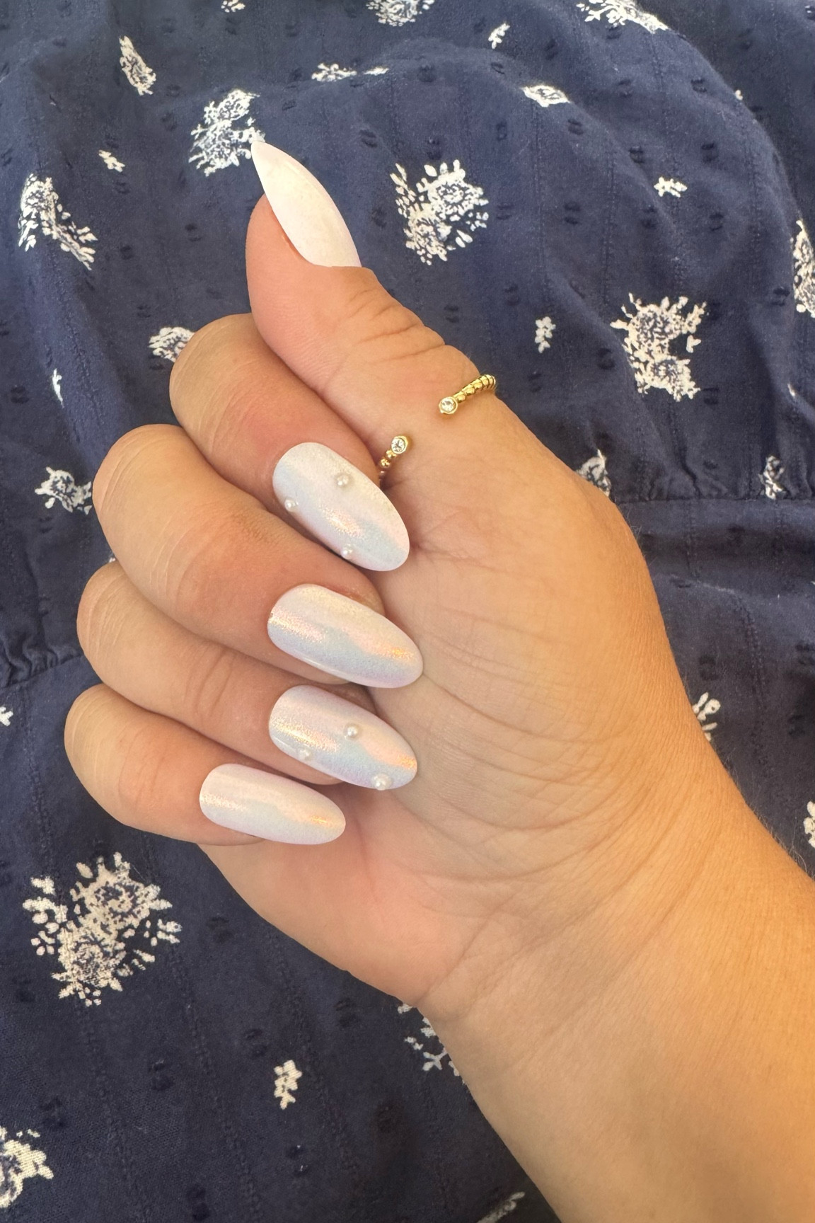 White iridescent nails with pearls 💅 

#LTKStyleTip #LTKBeauty