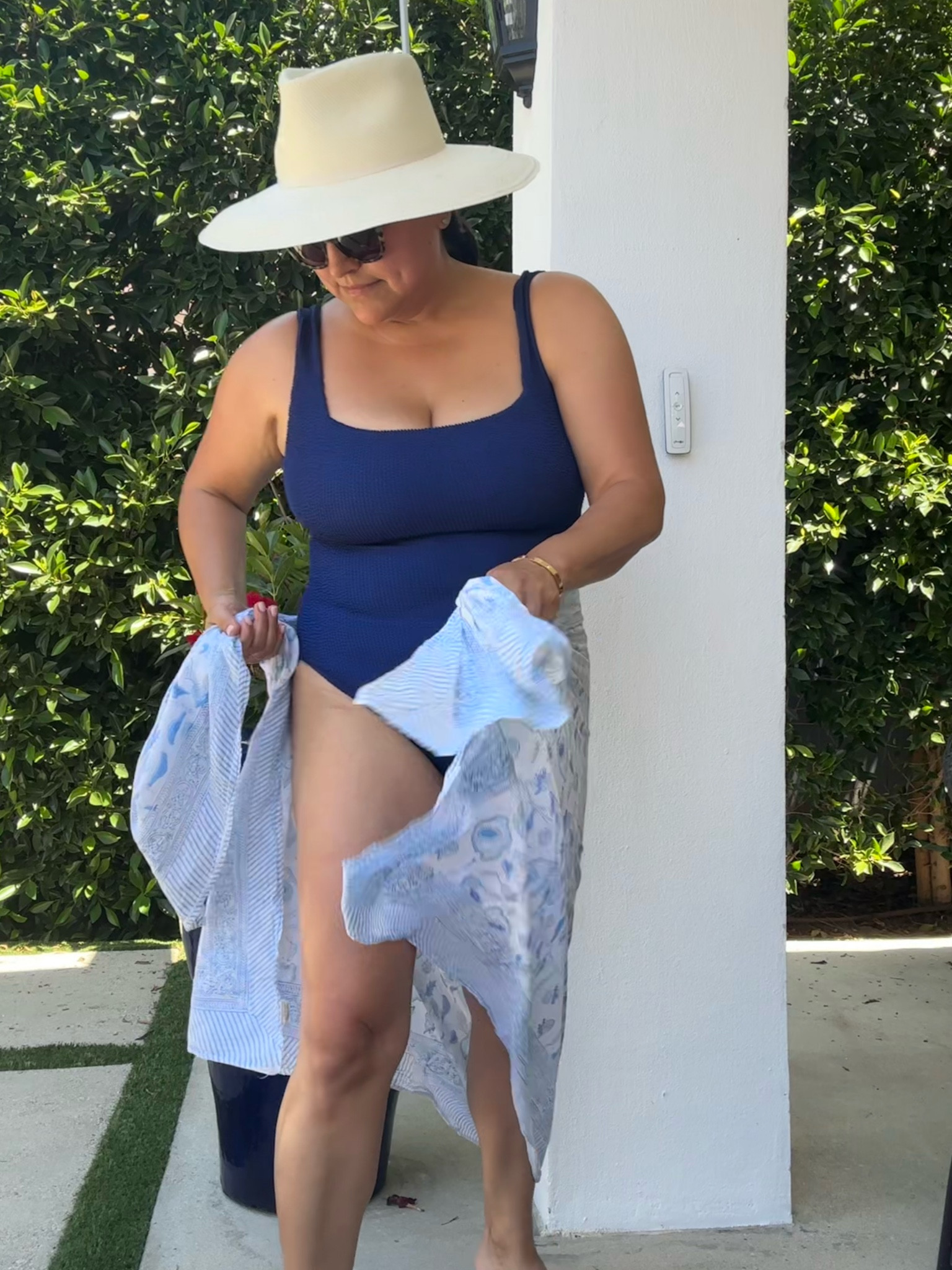 Love this new navy suit! A Classic! My go-to Cuyana hat and very old paraeo.

#LTKStyleTip #LTKOver40 #LTKSwim