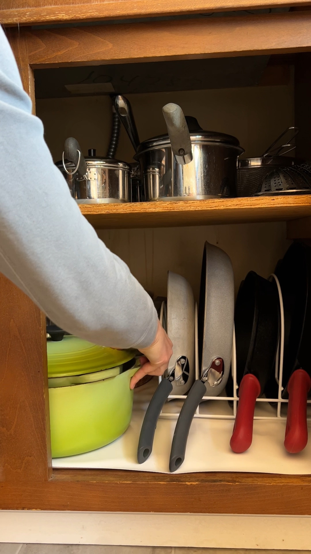 Giving my pot and pan cabinet a clean and reorganize feels so good! Even though my cabinets are old (1969 original!) they can still be made functional with the addition of a pan organizer that holds all my frying pans vertically, saving space and making it easy to find what I need to make dinner  

#LTKhome #LTKfindsunder50