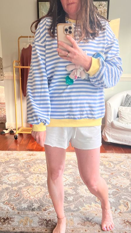 Those wanting to know where the sleeves hit on my medium sized light weighted sweatshirt. The color options are so fun and love the blue and white striped with yellow lining. Perfect spring layering sweatshirt. Throw it on and go. Get for Mother’s Day gift  

#LTKActive #LTKGiftGuide #LTKover40