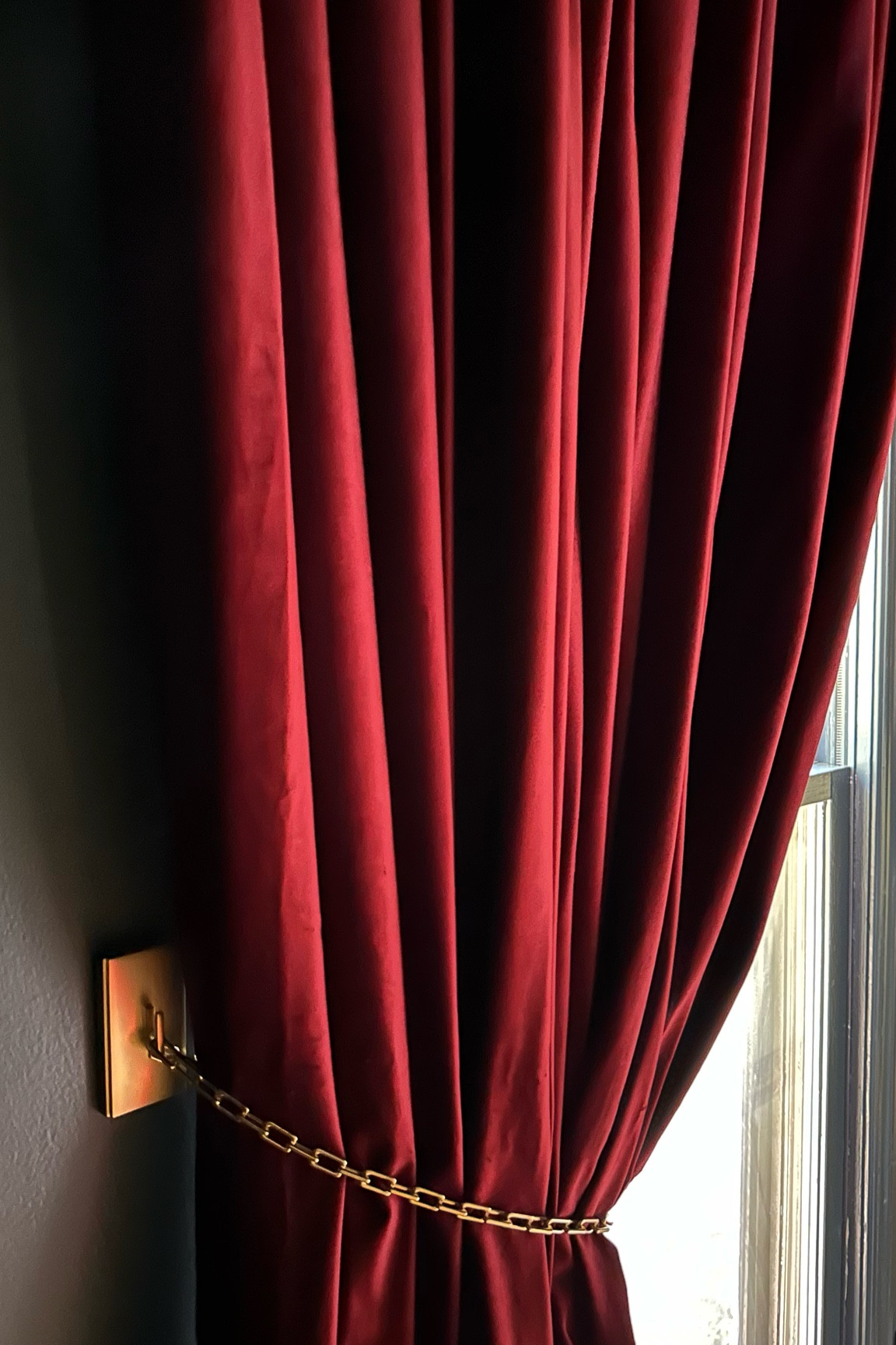The perfect solution to swag your draperies. These brass tie backs are so easy to unclamp when I want to create a dark room for movies with these curtains, and also look extra fancy against the red velvet draperies. Loving this new addition to the cozy tv room!

#LTKStyleTip #LTKFindsUnder50 #LTKHome
