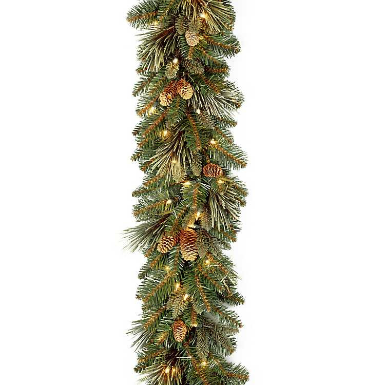 Pre-Lit Carolina Pine Garland with Flocked Cones | Kirkland's Home