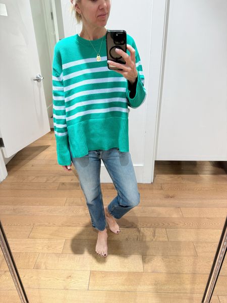 Split hem striped crewneck from Gap. Currently on sale. $48 marked down from $70 🙌🏼 Runs tts- but is a boxy fit. Gretchen in a small here. Love these Spring colors! Paired with our cult favorite cheeky Gap Jean. Also tts. 

#LTKover40 #LTKsalealert #LTKstyletip