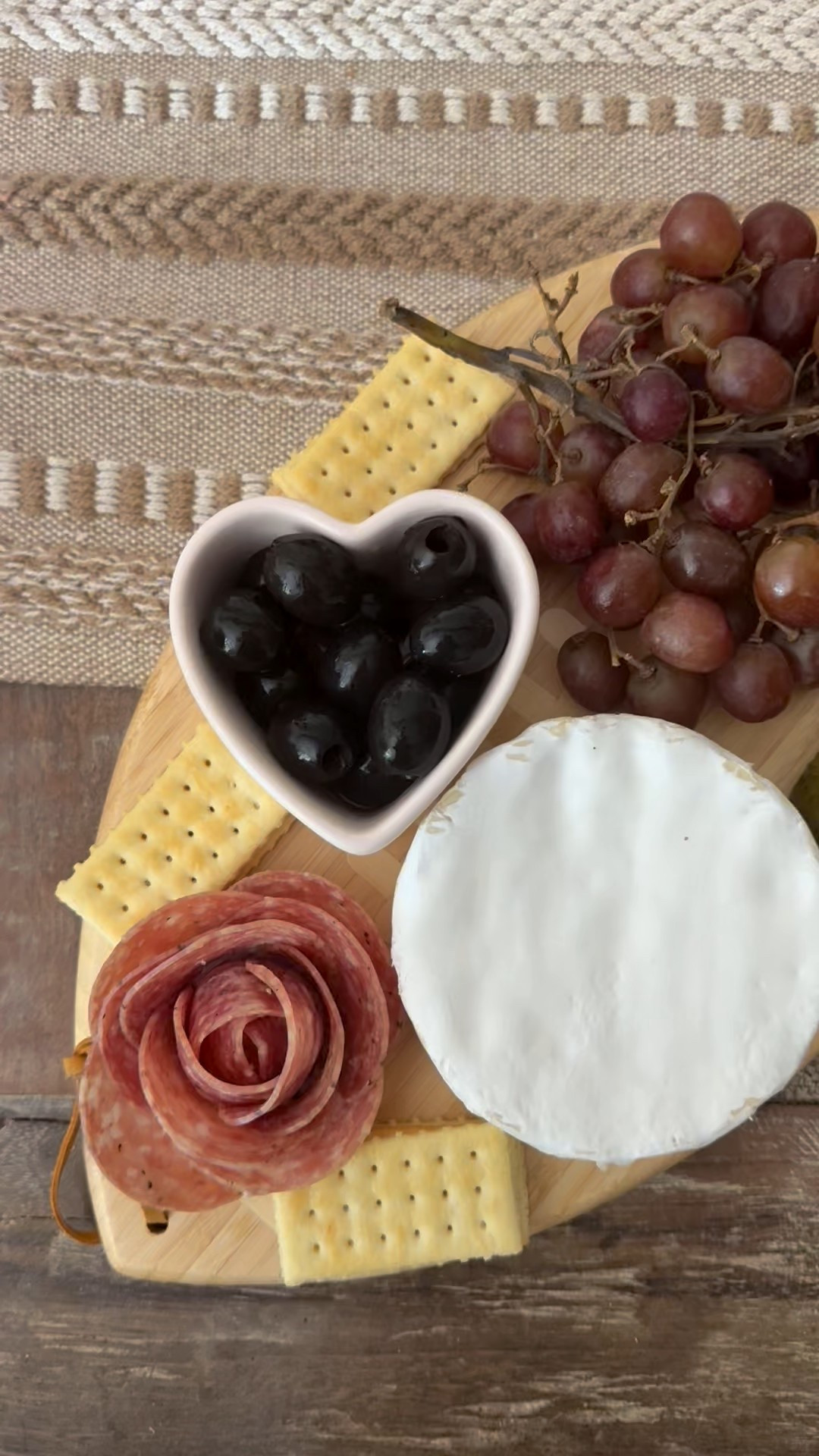 Football shaped charcuterie board // football shaped cheeseboard for the NFL playoffs, Indiana NCAA football championship, Super Bowl and more! Heart shaped ramekin 💗 

#LTKFindsUnder50 #LTKHome #LTKfoodie