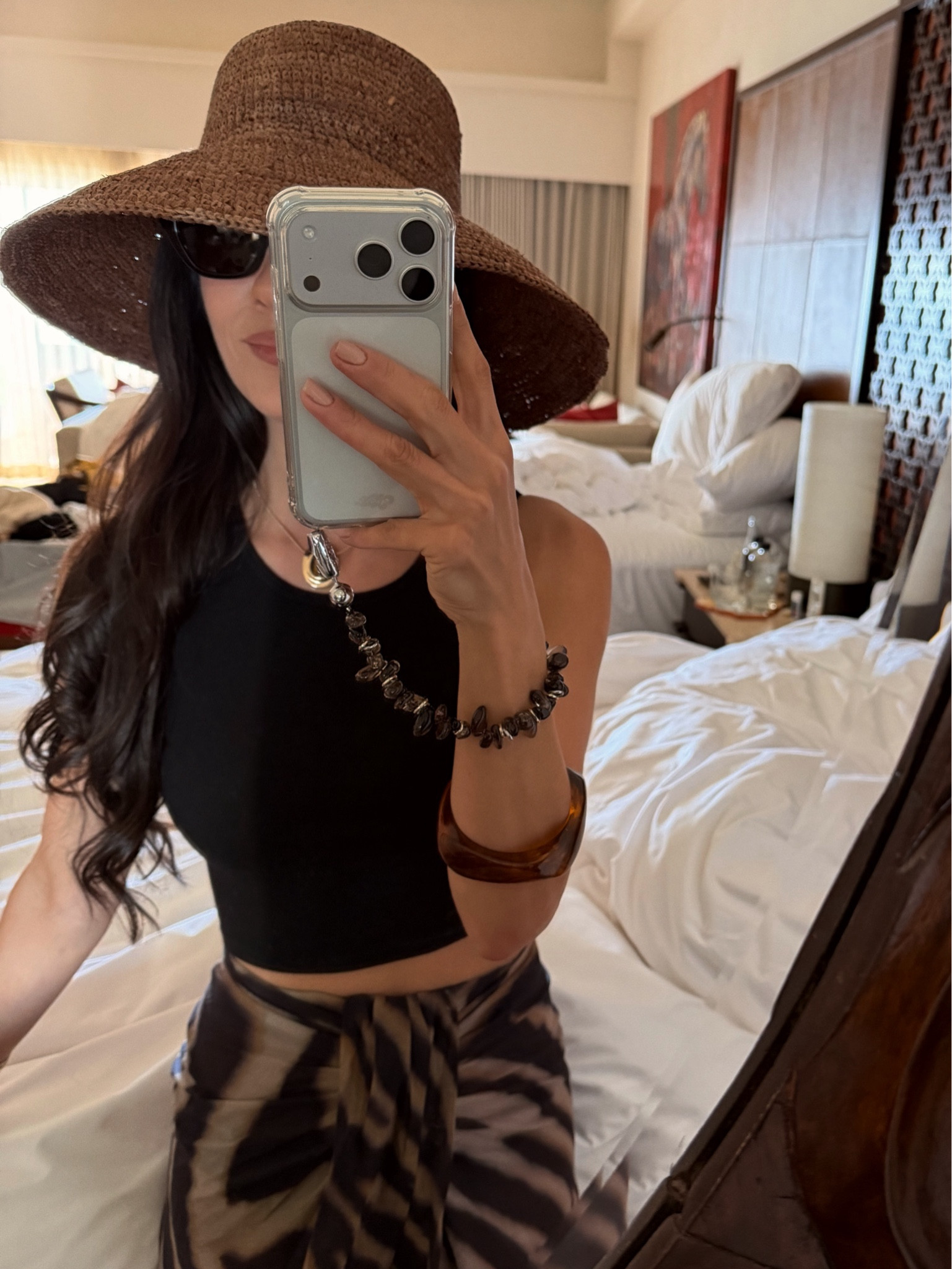 Vacay mode 🖤 this wide brim and this phone case with fun chain are definitely two of my favorite accessories. I packed.

#LTKTravel #LTKSwim #LTKOver40