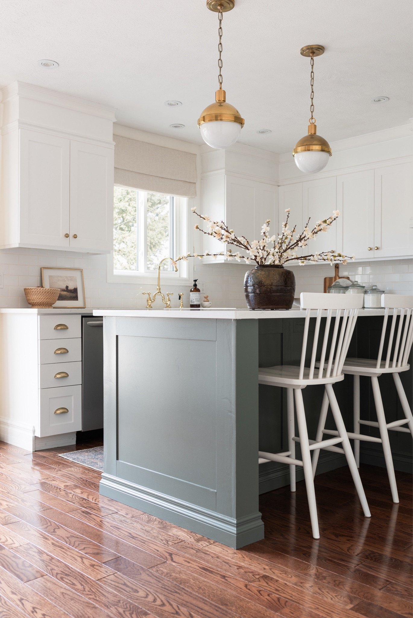 Love the warmth our recently painted island adds to our kitchen, the colour plays so weak with our vintage landscape art, Loloi runner and brass accents. 😍

Brass globe pendants, vintage pot, flowering stems, vintage landscape prints, Roman shade



#LTKhome