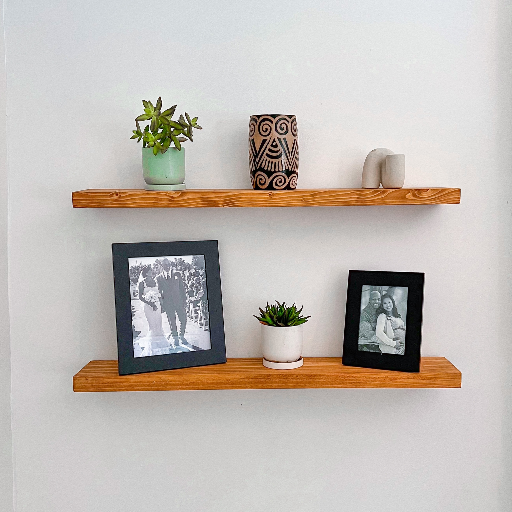 Pre-fab floating shelves 
This install took less than an hour! Had to replace the drywall anchors with sturdier, metal ones since the shelf needed more stability. Other than their modification, it was a great install kit! Planning on getting another two for the other side of the fireplace.

Got this 36” pair in walnut finish for less than $65!
#floatingshelfdiy #womenwithtools #handywoman #momswithtools #drillingmom #homedecordiy

#LTKhome