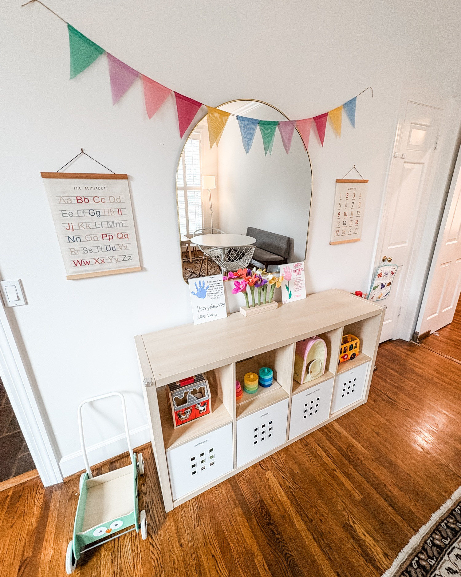 How cute is this little playroom?! We love when the organization naturally fits in and looks cohesive. The labeled bins in the bottom of the Ikea cubbies work perfectly to corral clutter! 

 