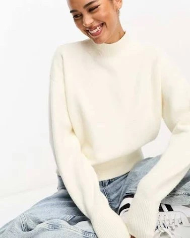 White ribbed mock neck sweater perfect for chilly nights or wrapped around shoulders over a dress for a preppy coastal look

#LTKStyleTip #LTKFindsUnder100 #LTKSeasonal