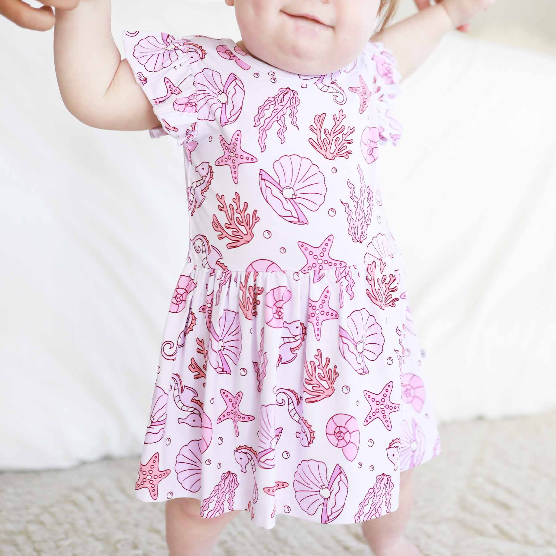 Sleeveless Twirl Bodysuit | Tiny Tides Pink | Caden Lane