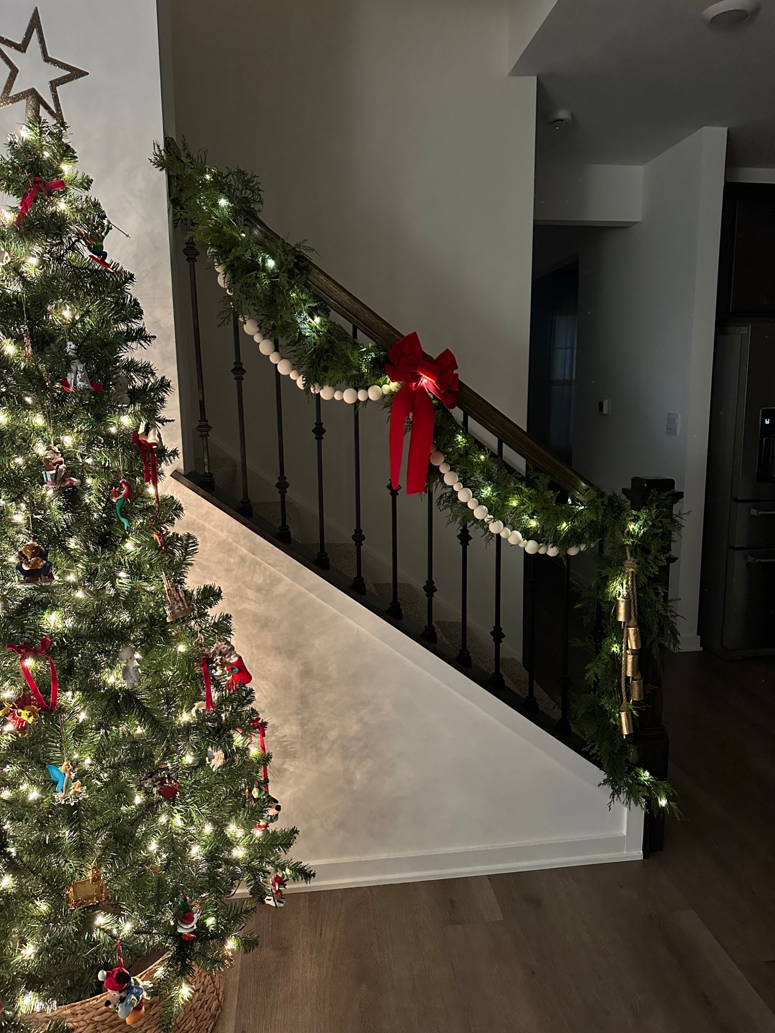 Love this garland set up we purchased for our railing and also our fireplace mantle! This in the 9ft. I added twinkle lights to make it pop and feel even more cozy at night🎄🤩 

#LTKHoliday #LTKHome #LTKCyberWeek
