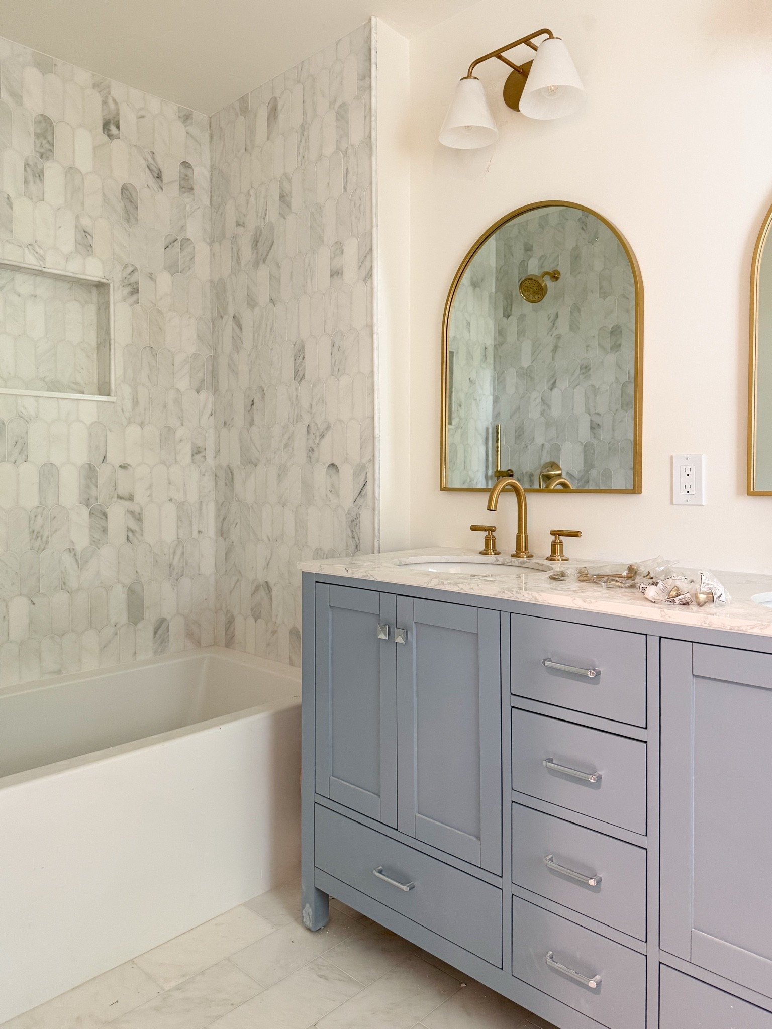 The prettiest shared girls’ bathroom 🩶 LOVE the color of this vanity and the brass accents and accessories that we chose! Will be swapping new brass hardware onto the cabinet fronts and drawers soon…

#LTKHome #LTKKids #LTKdayinmylife