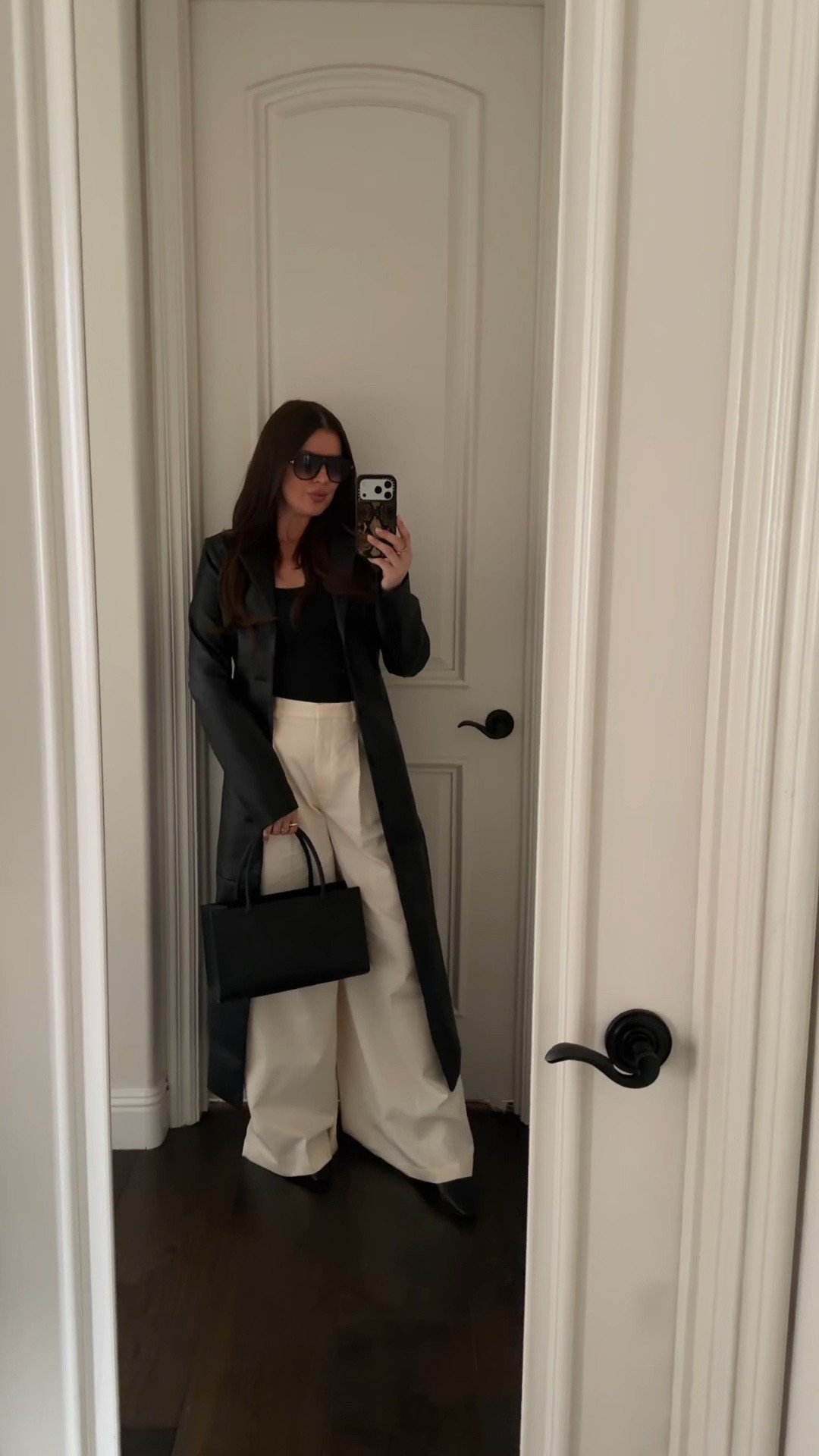 The perfect spring outfit for work or for running errands if you want to look put together and chic! 

Styling a black leather trench coat with a charcoal tank, nude wide leg pants, black leather sling backs and a small black leather tote. Adding gold jewelry and aviator sunglasses to finish the look.

Everything size S, fits true to size. 

#LTKWorkwear #LTKgrwm #LTKootd