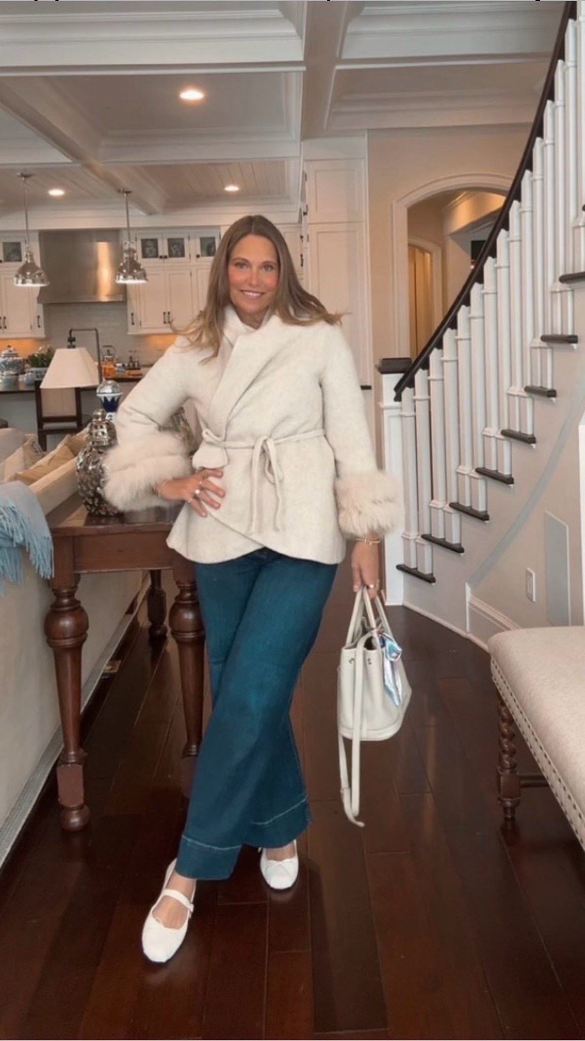 I love this super chic outfit I recently put together. This coat features gorgeous faux fur detailing at the ends of the sleeves. I paired it with dark wash denim and a white bag for a polished look.

#LTKSeasonal #LTKOver40 #LTKMidsize