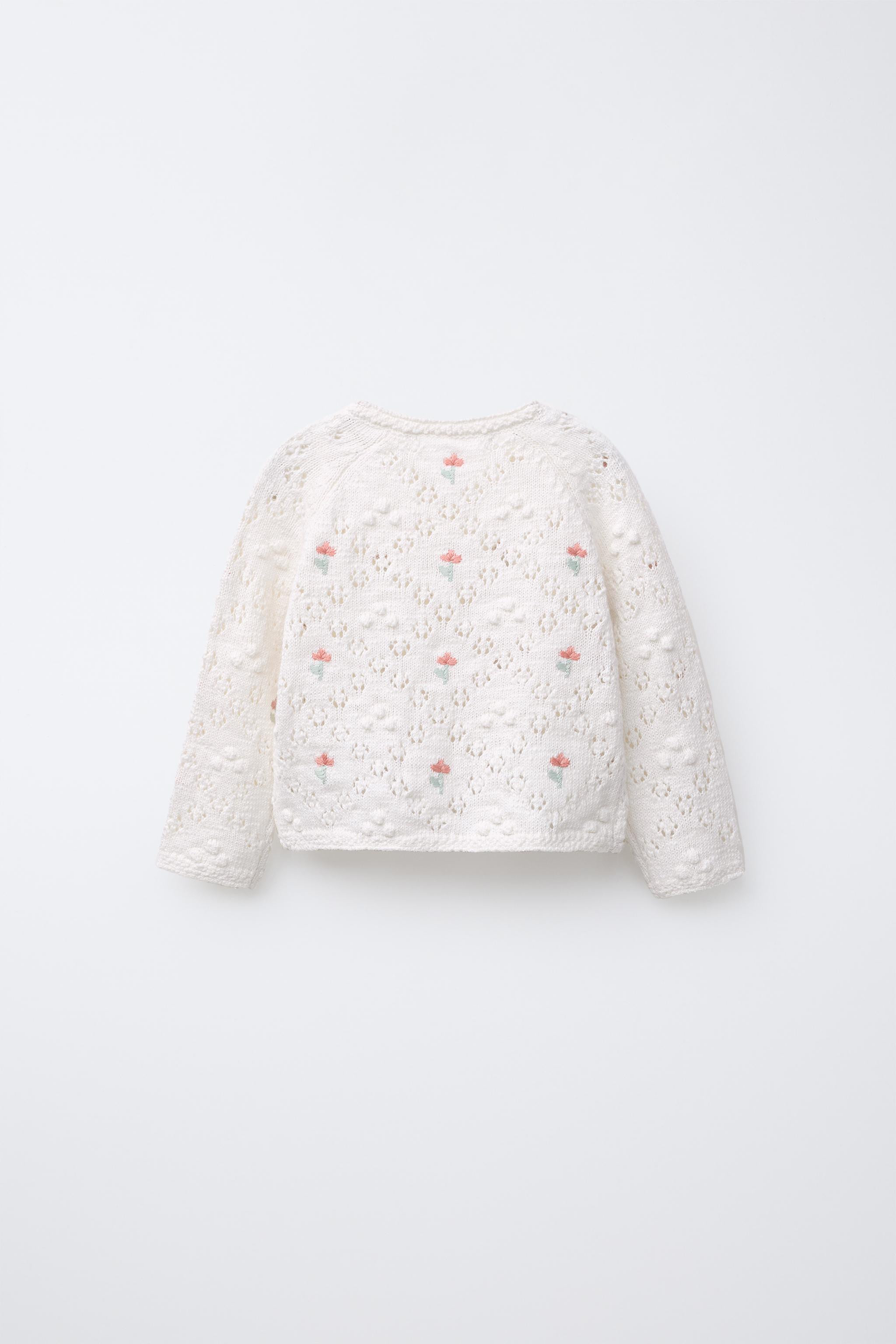 Knit jacket with a round neck and long sleeves. Front button closure. Floral embroidery detail. | Zara US