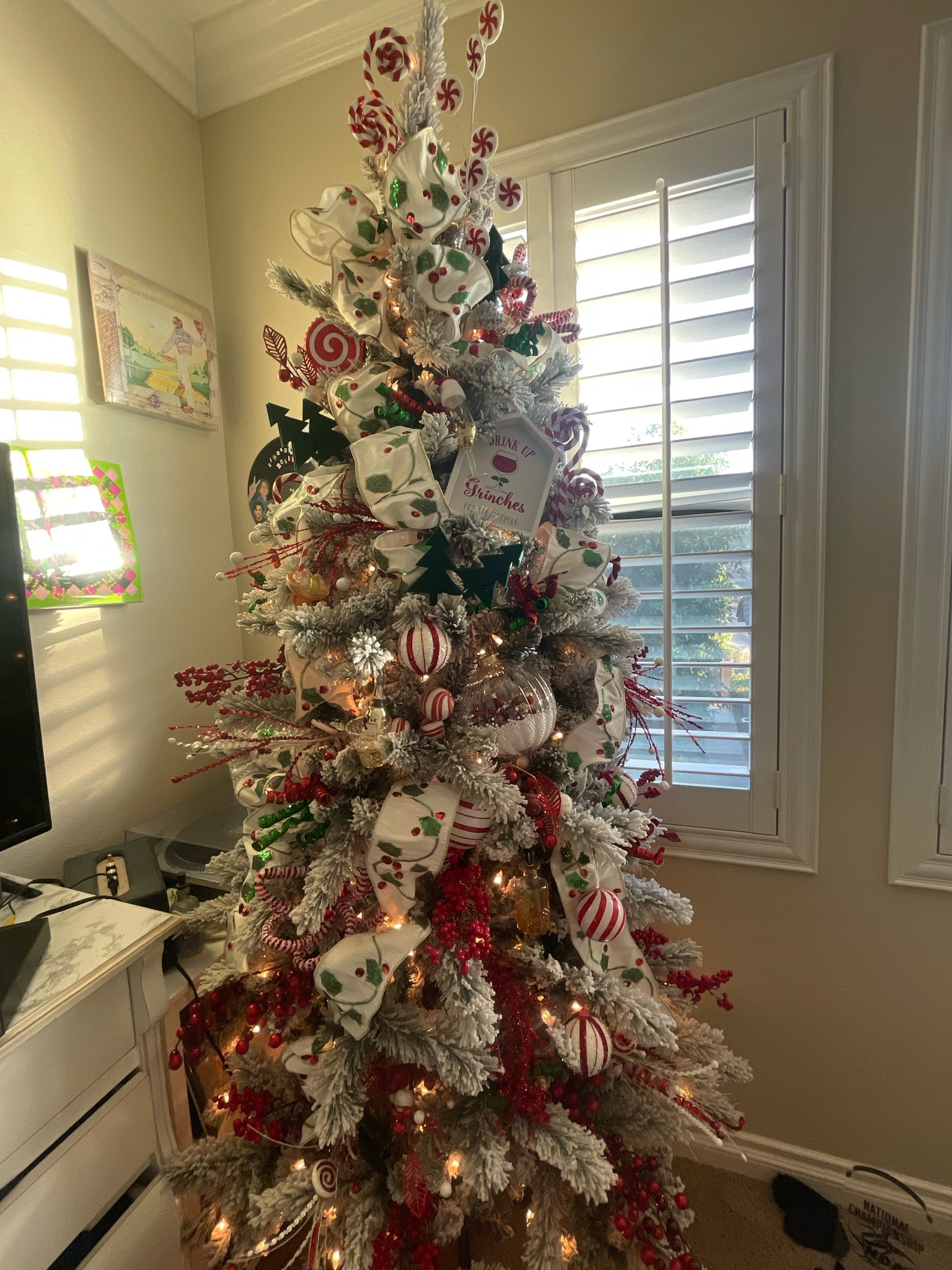 Champagne Christmas tree. It’s filled with holly ribbon, big berry snowy ornaments and of course champagne ornaments  

#LTKhome #LTKSeasonal #LTKHoliday