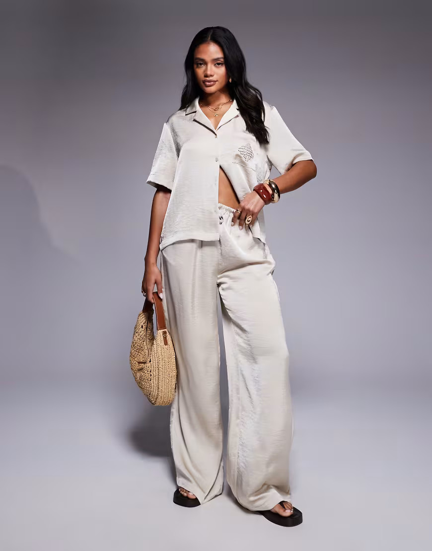The Couture Club co-ord emblem satin trousers in beige-Neutral | ASOS (Global)