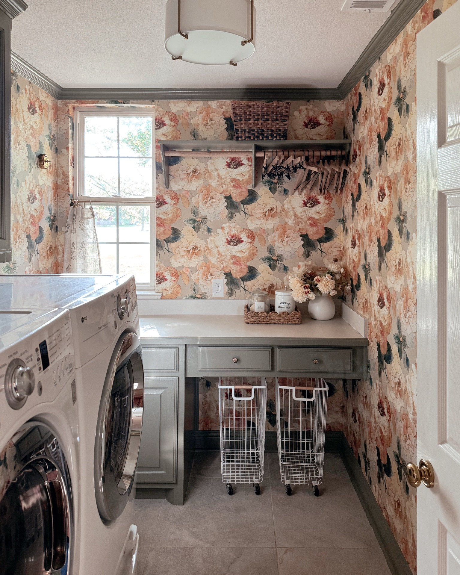 Paint color is Muted Sage by Behr 🎨 

Laundry room // gold cabinet hardware // laundry baskets

#LTKHome
