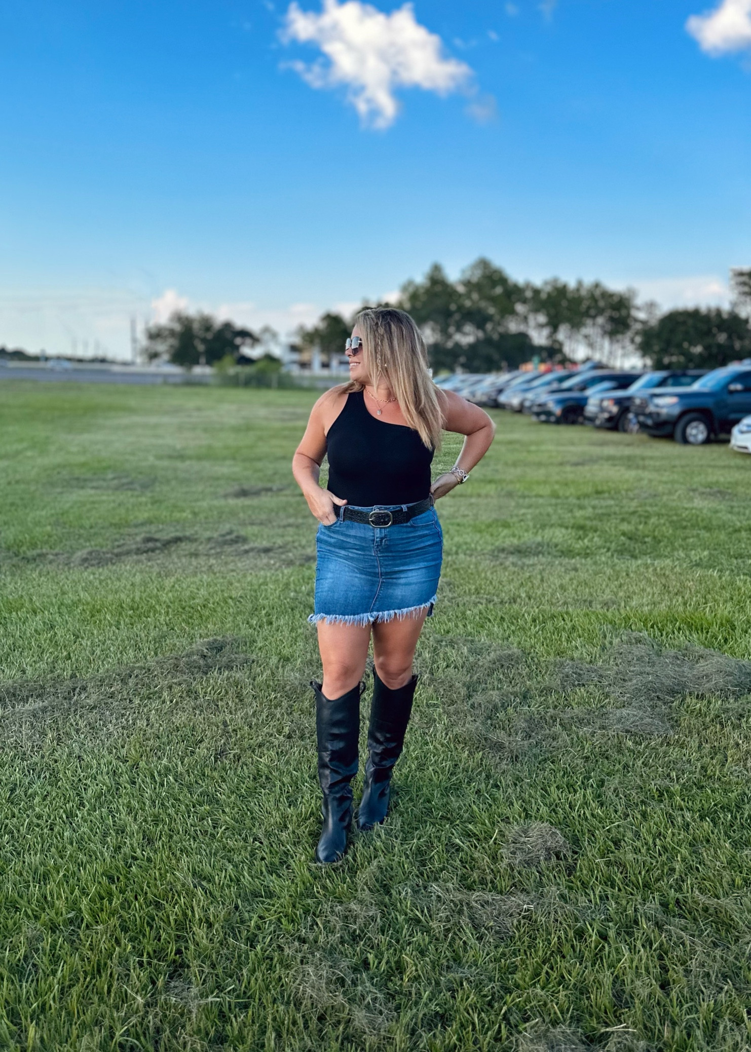 I’m obsessed with the fact denim skirts are back in style, because I’ve always loved them with my country girl outfits. I paired this with a size large one shoulder bodysuit that I could have easily sized down on since they are so stretchy(and the smaller size gives more support for the girls). I also added my black pair of western boots for some sass. I always size up a half size in my cowgirl boots for extra room in the calves or go for a wide leg style since I have large muscular calves.

Western wear
Western outfit 
Country concert
Country concert outfit 
Black Western boots
Cow girl boots
Florida country concert 
Midsize style
Midsize fashion 
Midsize outfits
Midsize skirt
Midsize bodysuit 

#LTKfindsunder50 #LTKstyletip #LTKmidsize