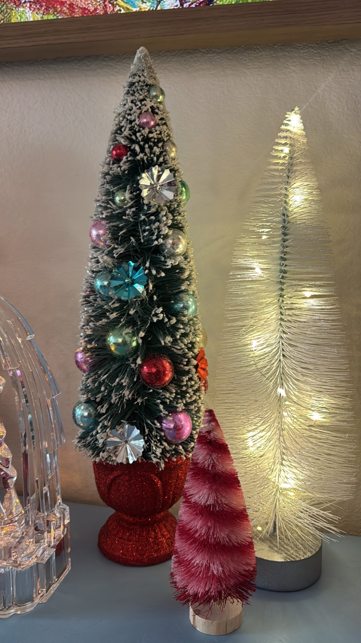 Colorful flocked tree and white flocked lighted tree 

#LTKSeasonal #LTKHoliday #LTKHome