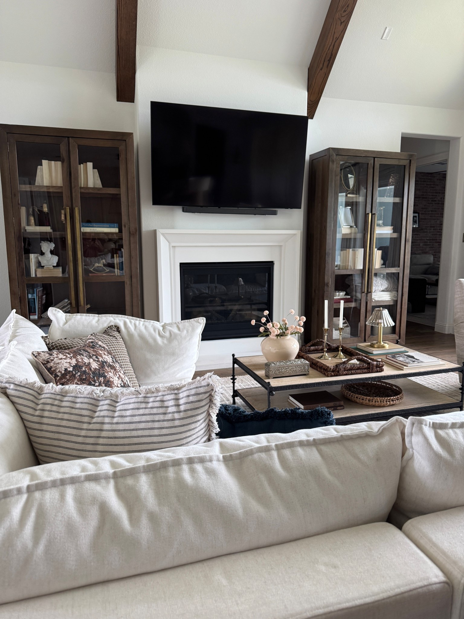 Living room, transitional design, home decor, coffee table, tall cabinets, sectional, throw pillows, modern farmhouse, home inspo, home interior, neutrals

#LTKHome #LTKSaleAlert #LTKmomlife