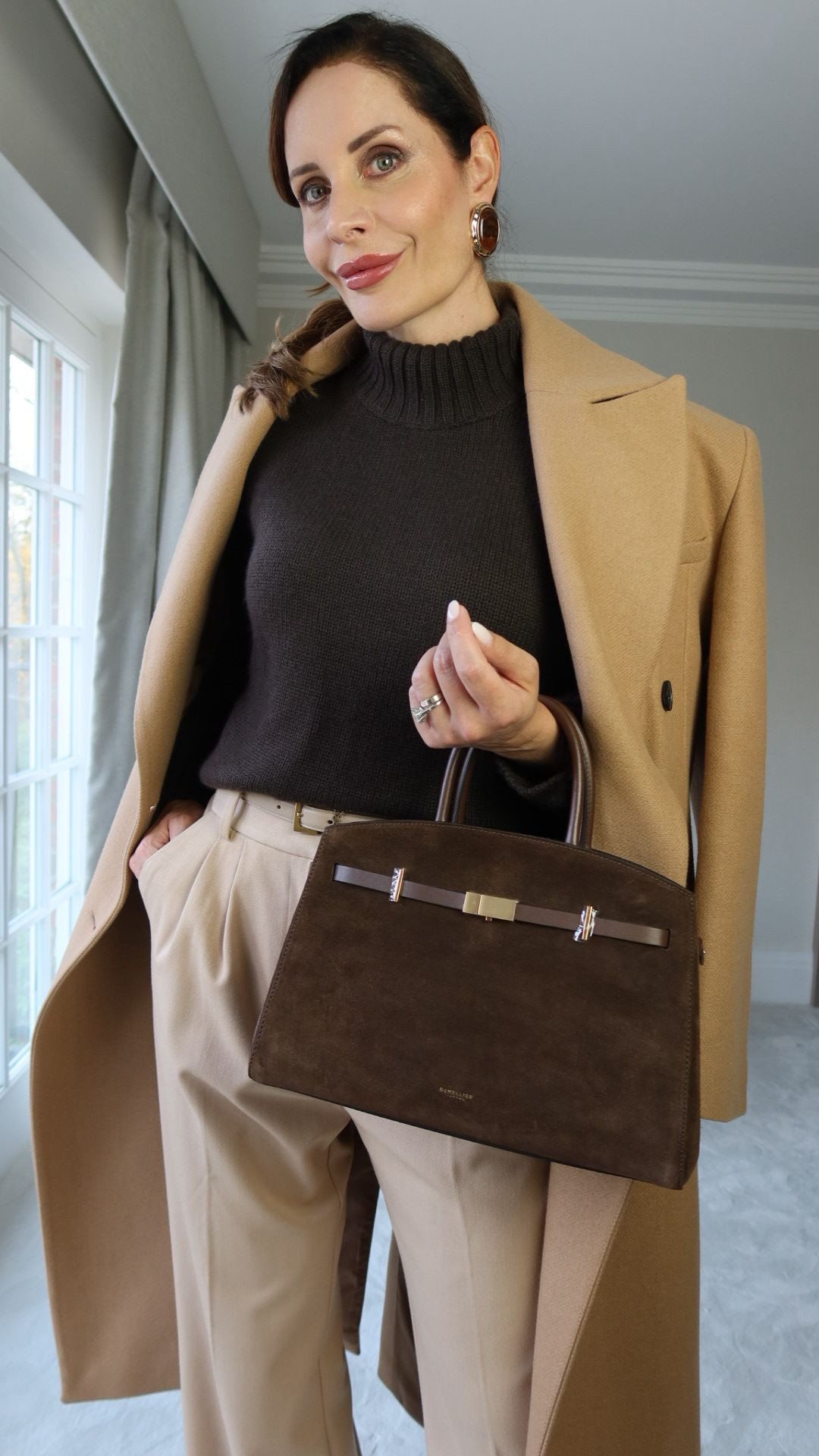 Neutral dressing done right 🤎
This is how you make beige, camel, and chocolate tones look intentional — not boring.

The secret?
✔ Clean tailoring
✔ Rich textures
✔ One standout accessory (this bag does all the work)

This is my go-to formula for an elevated everyday look that feels timeless, polished, and expensive — without trying too hard. I’ve linked the exact pieces where possible and added similar + budget-friendly options to recreate the look.

Outfit details:
• Coat – Karen Millen
• Sweater – Almada
• Pants – Favourite Daughter
• Belt – YSL
• Bag – Demellier
• Earrings – Self-Portrait

#LTKstyle
#LTKfashion
#LTKfinds
#QuietLuxuryStyle
#NeutralOutfits
#CapsuleWardrobe
#ElevatedBasics
#ChicEveryday
#ClassicStyle
#ModernElegance 

 #LTKgrwm #LTKootd #LTKSeasonal