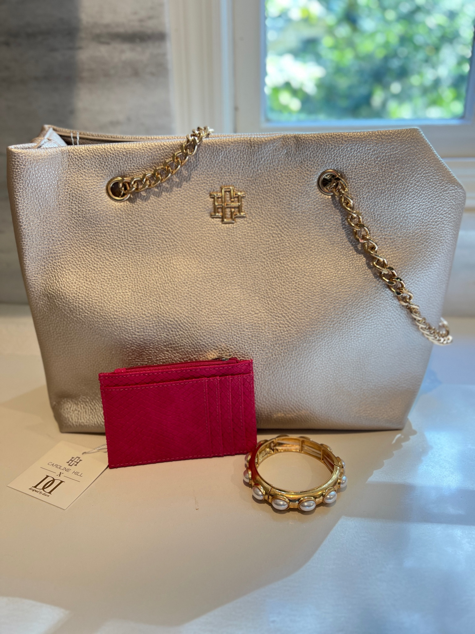 The best collection and guides for women over 40 
Pearl metallic tote 
Pink wallet 
Pink clutch 
Souther style 
Peal accessories 

#LTKOver40 #LTKGiftGuide #LTKFindsUnder50