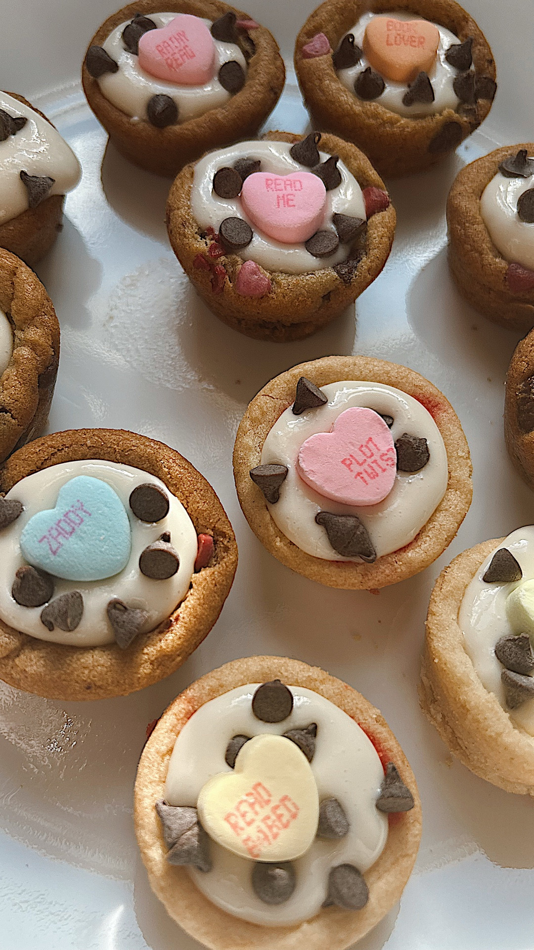 Cannoli cookie cups filled with Trader Joe’s cannoli dip and topped with the cutest book themed conversation hearts. Dessert for the book lovers.