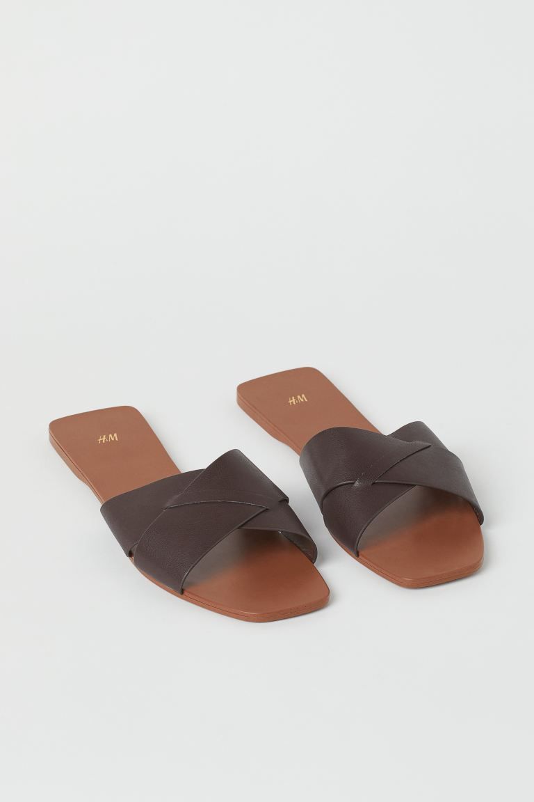 Slides in faux leather with square toes and wide, crossover foot straps. Heel height approx. 1/2 ... | H&M (US + CA)