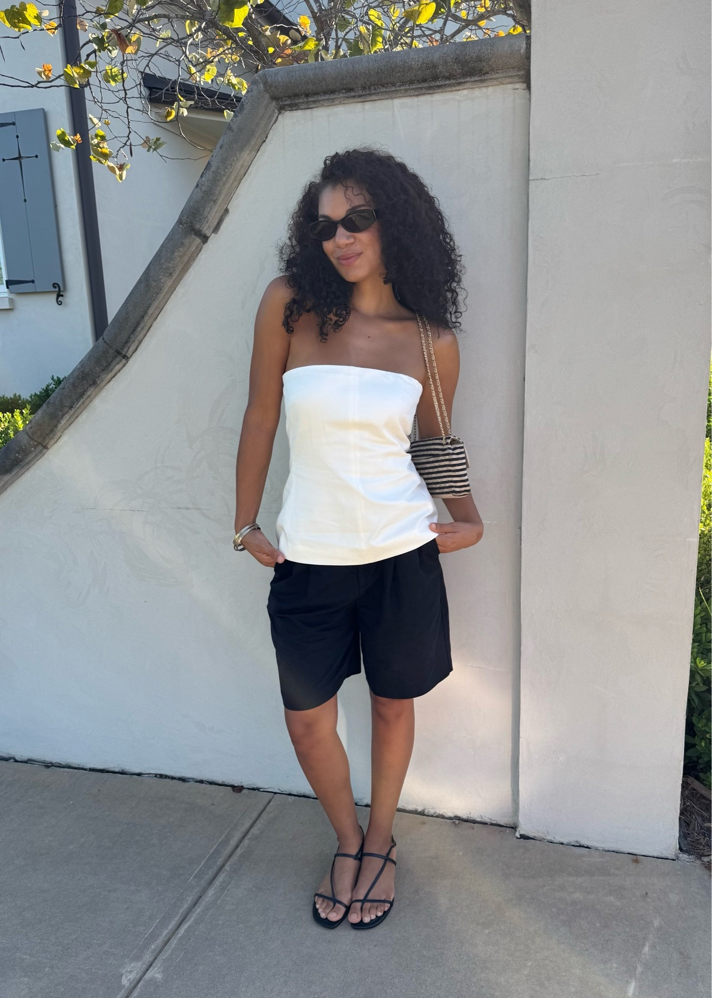 Early fall outfit! Long black shorts, strapless top, sandals

#LTKootd