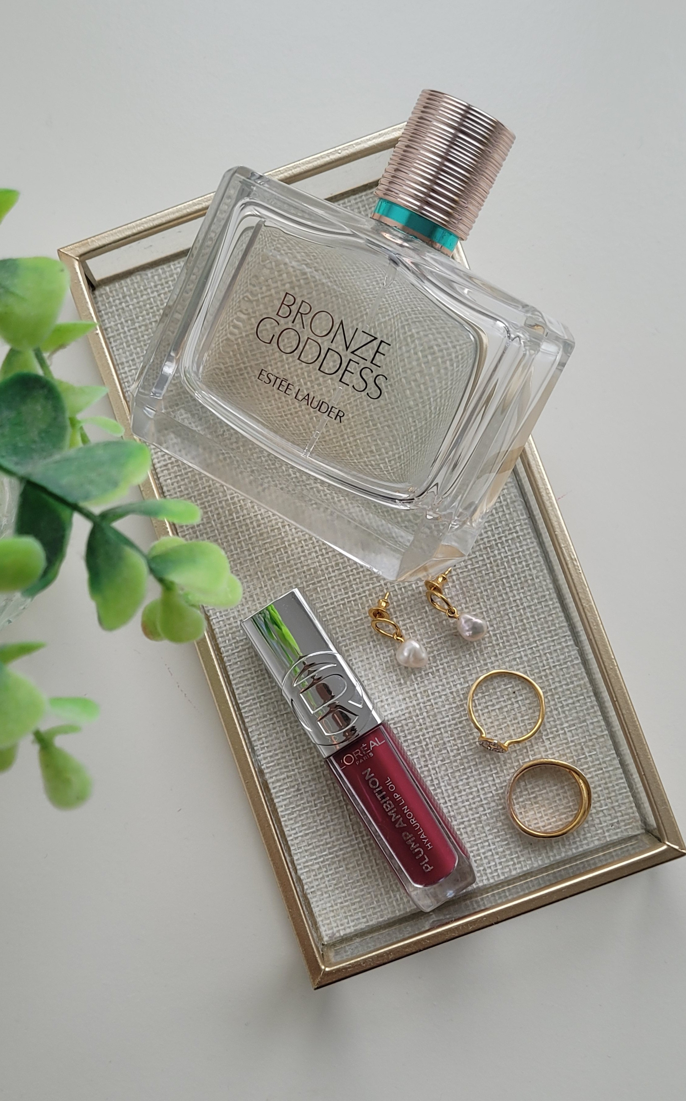 Today's essentials: pearl earrings, gold rings, a berry lip gloss and fragrance.Estee Lauder Bronze Goddess perfume, Monica Vinader jewellery and L'Oréal lip plumping gloss ❤️#monicavinader #goldjewellery #pearls #fragrance 

#LTKwinter #LTKbeauty #LTKfestive